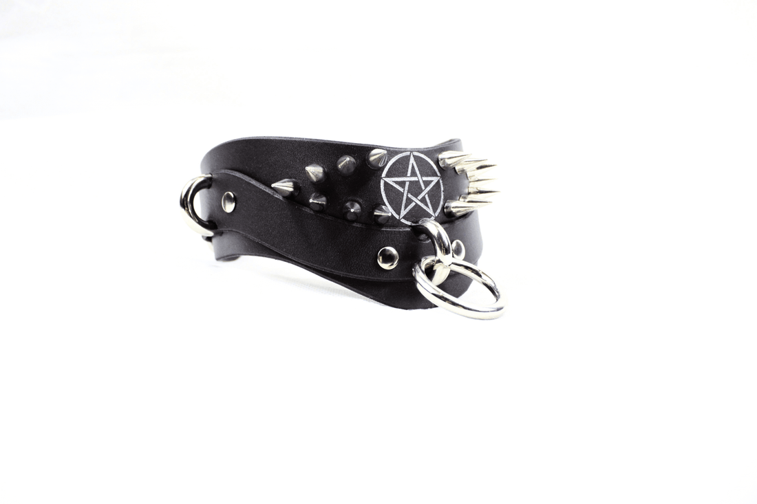 Luxury Spiked BDSM Collars displayed on dark satin background