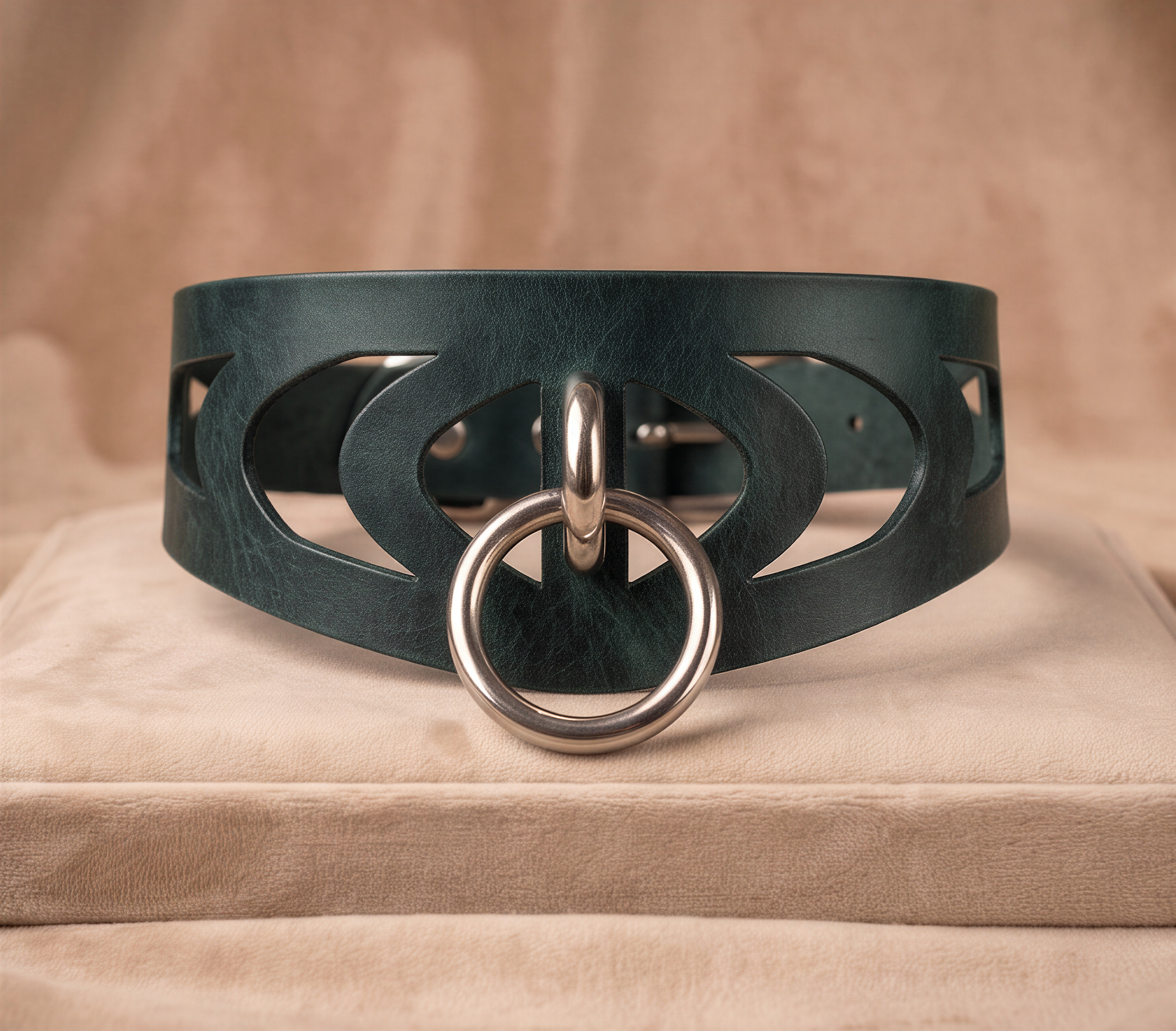 A dark green leather choker necklace with a silver metal ring and a circular cutout design on the front.