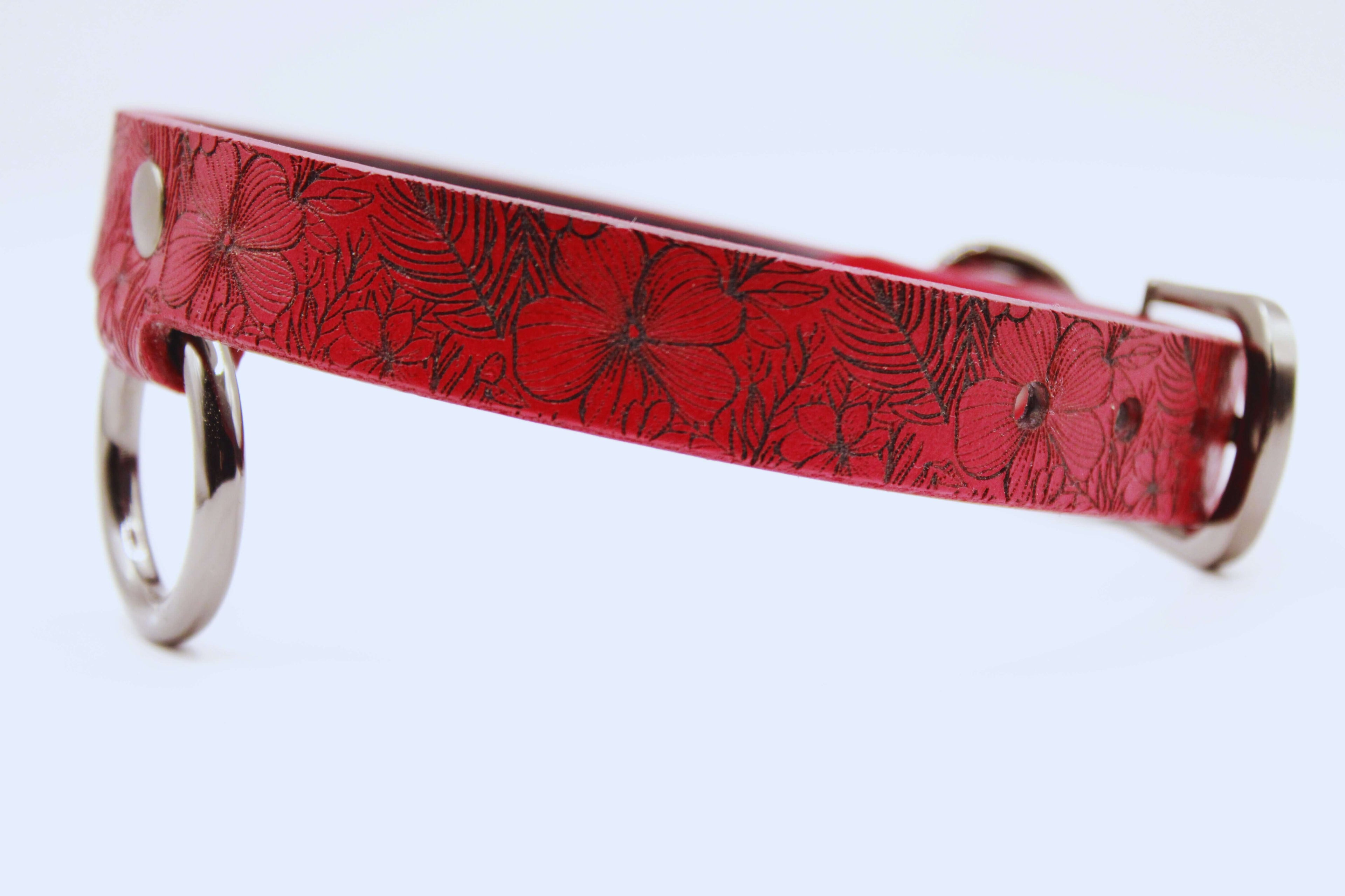 Red floral leather collar with silver hardware, perfect for a discreet submissive look.