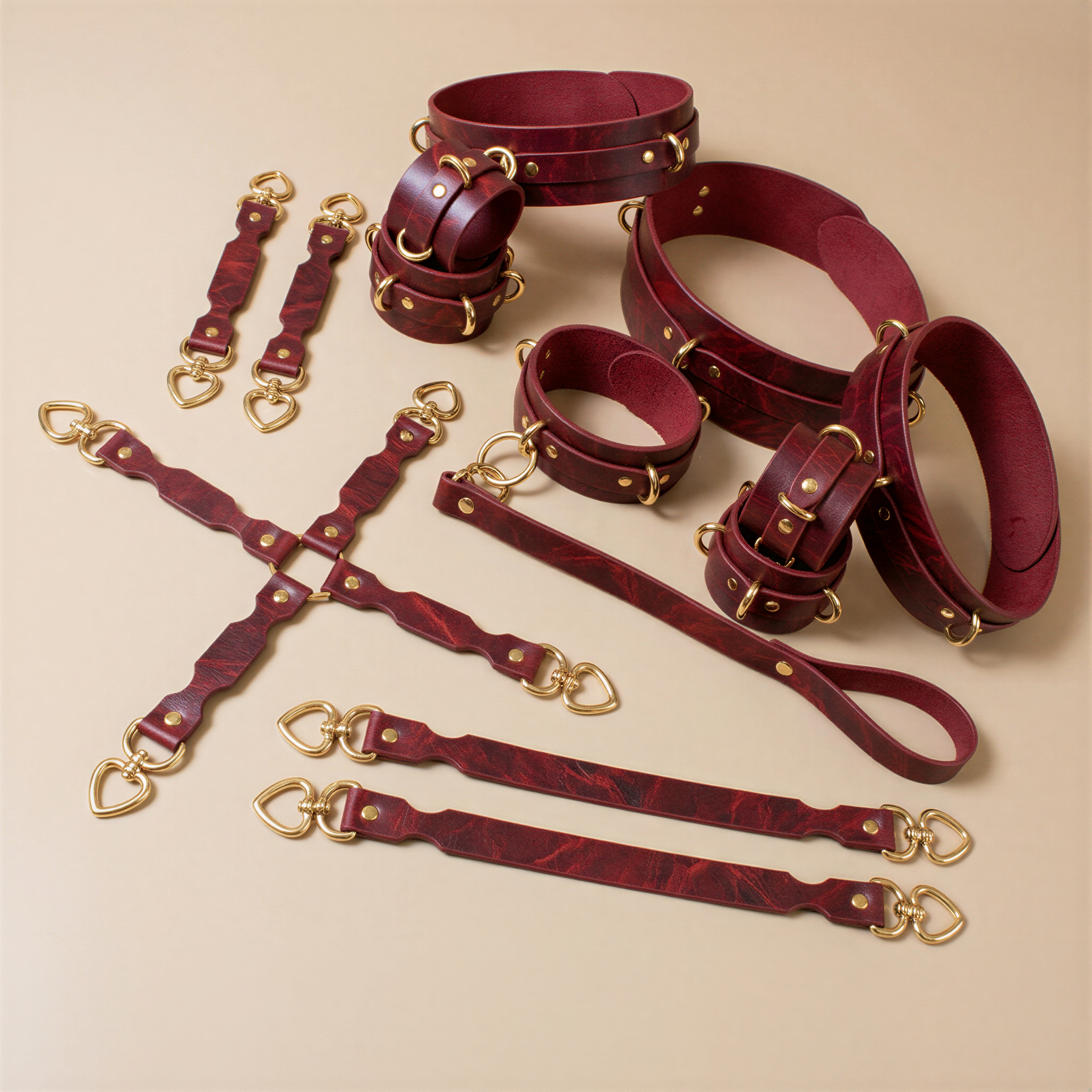 a collection of burgundy leather straps and buckles, arranged on a beige background.