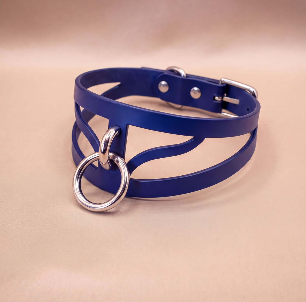 A blue leather choker necklace with a silver ring and buckle.