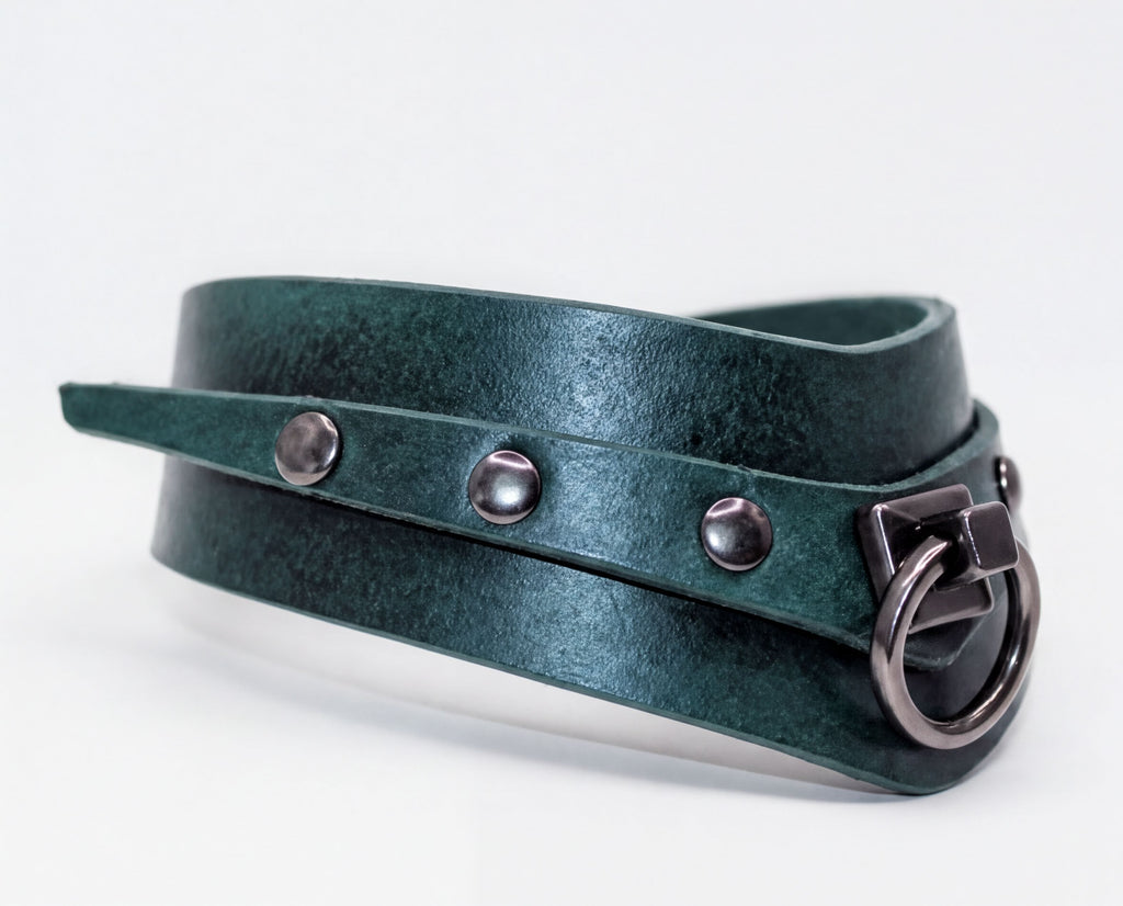 A dark green leather choker necklace with metal studs and a metal clasp.