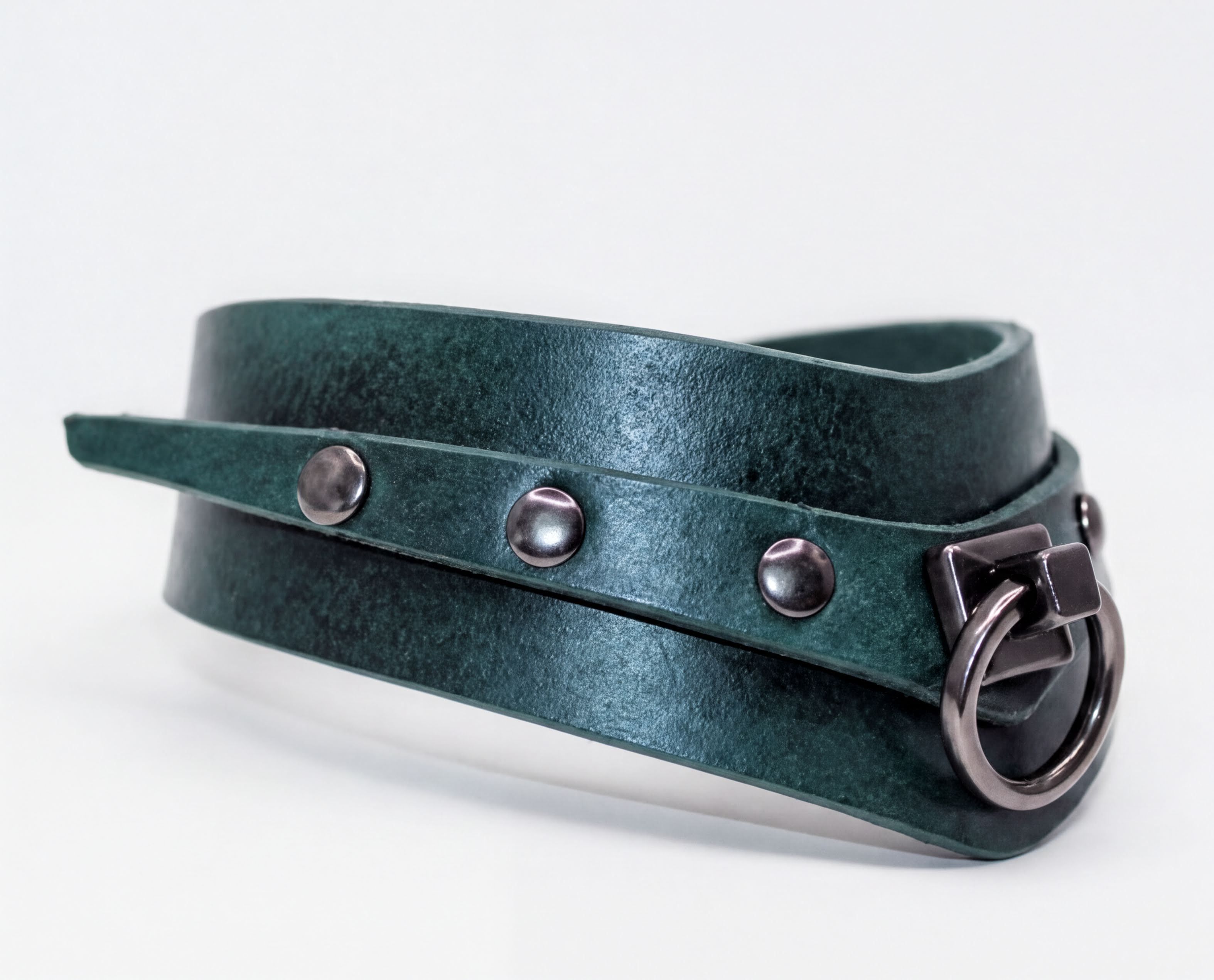 A dark green leather choker necklace with metal studs and a metal clasp.
