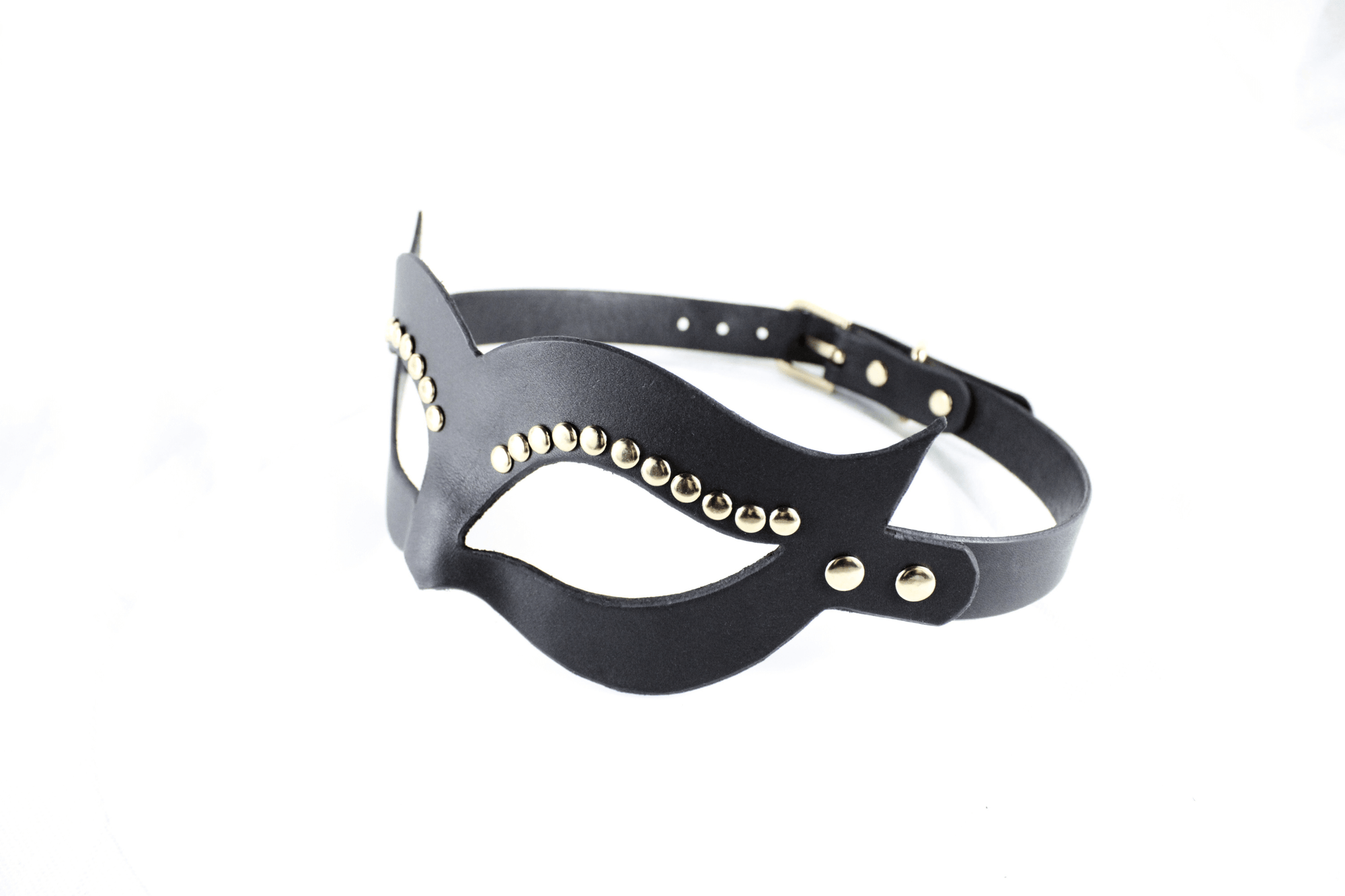 A black leather mask with gold studs on the sides and a black strap.