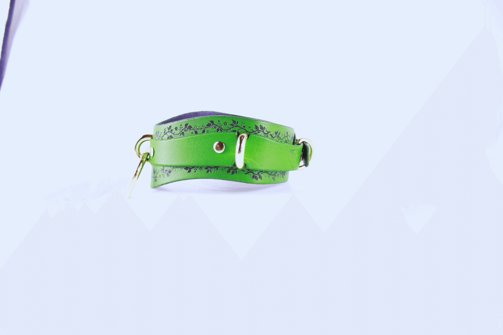 Green Vine Leather Submissive Collar with black vine pattern and polished rings.
