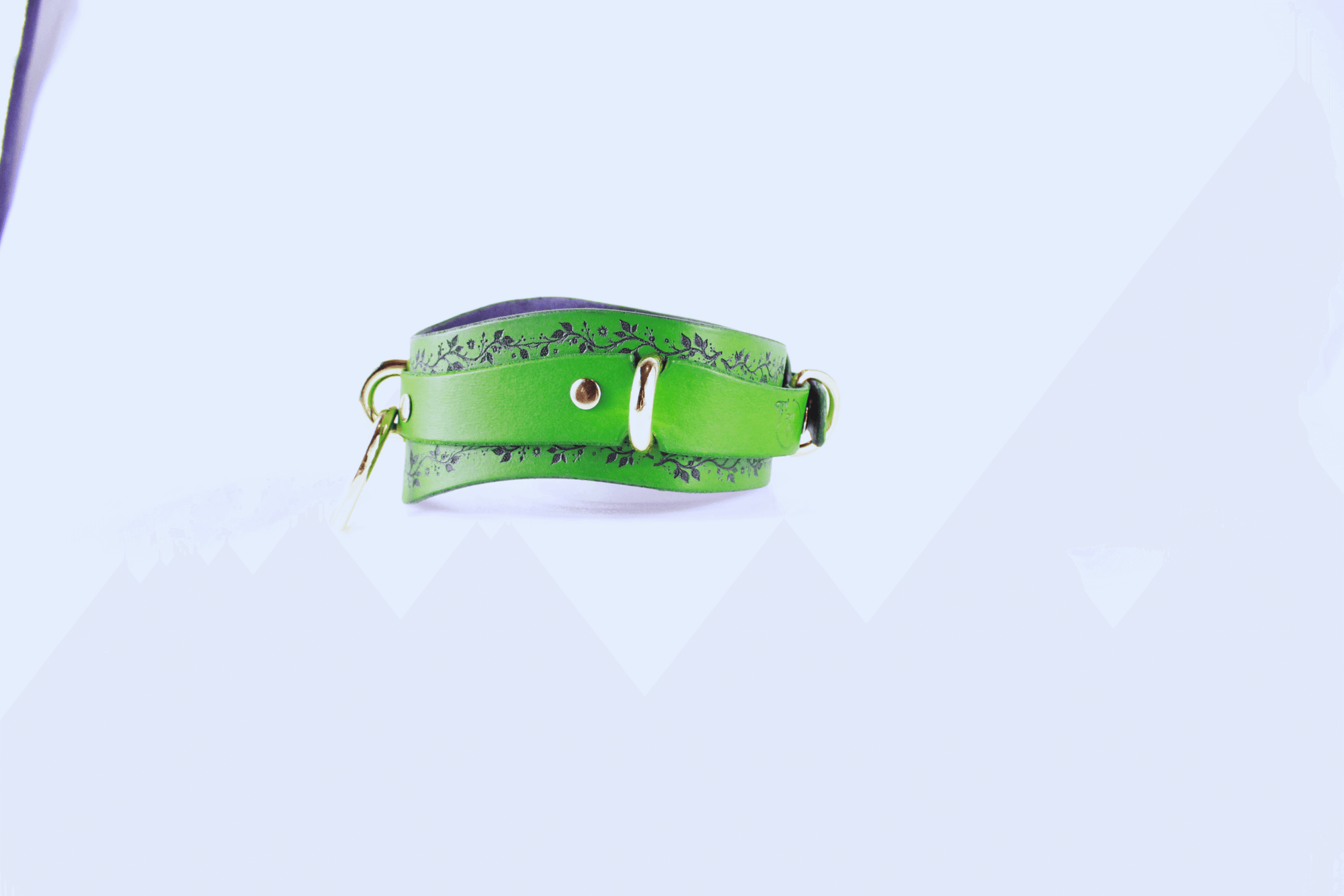 Green Vine Leather Submissive Collar with black vine pattern and polished rings.