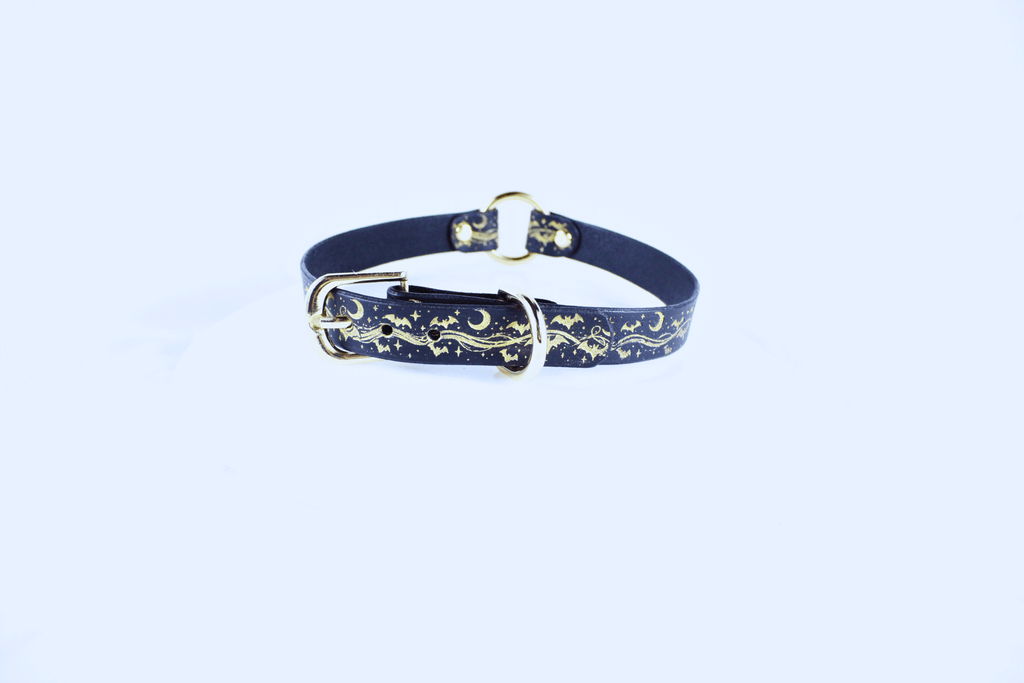 Bats BDSM Collar – Celestial Leather Choker featuring a golden motif of bats, moons, and stars.