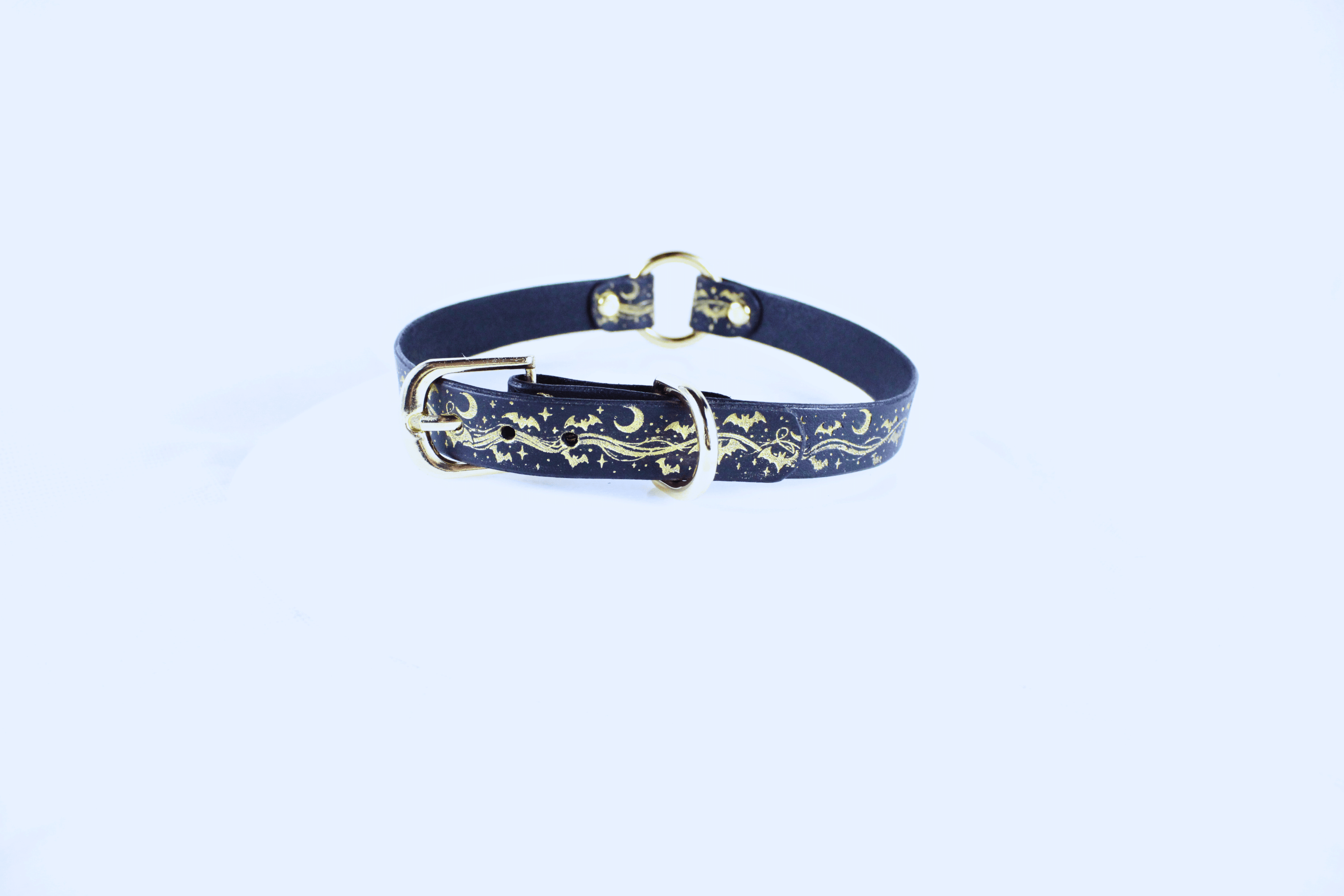 Bats BDSM Collar – Celestial Leather Choker featuring a golden motif of bats, moons, and stars.