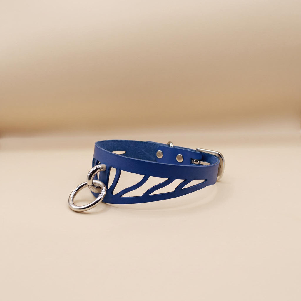 A blue leather choker necklace with metal rings and a metal clasp.