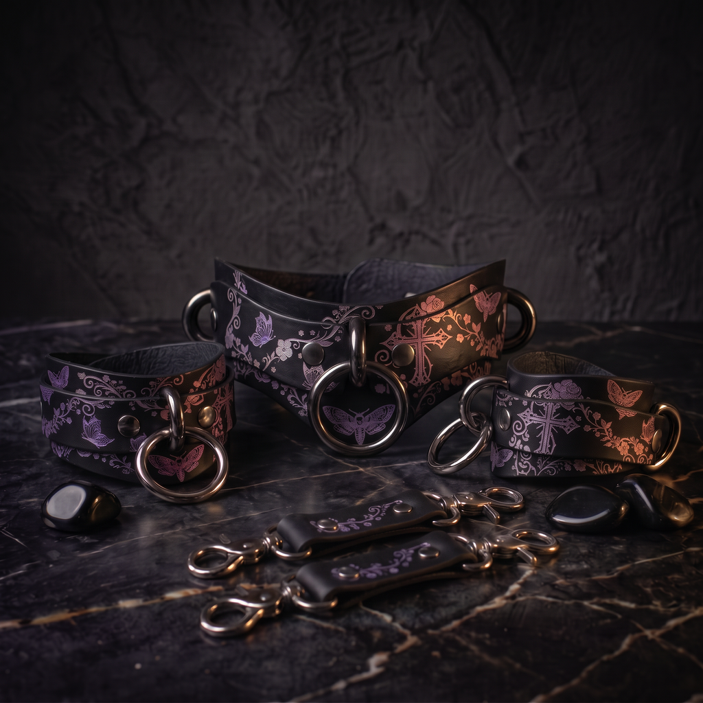 a collection of leather straps and charms with floral and butterfly designs, arranged on a dark surface.
