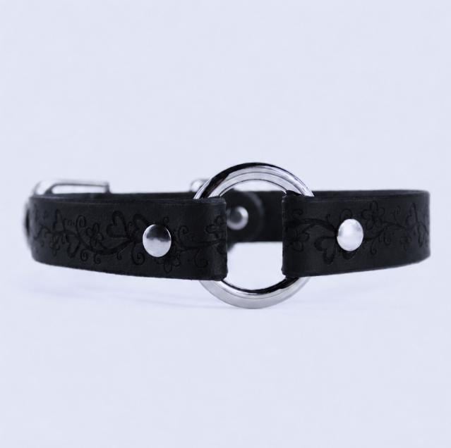 A black leather collar with a silver metal ring and two silver buttons.