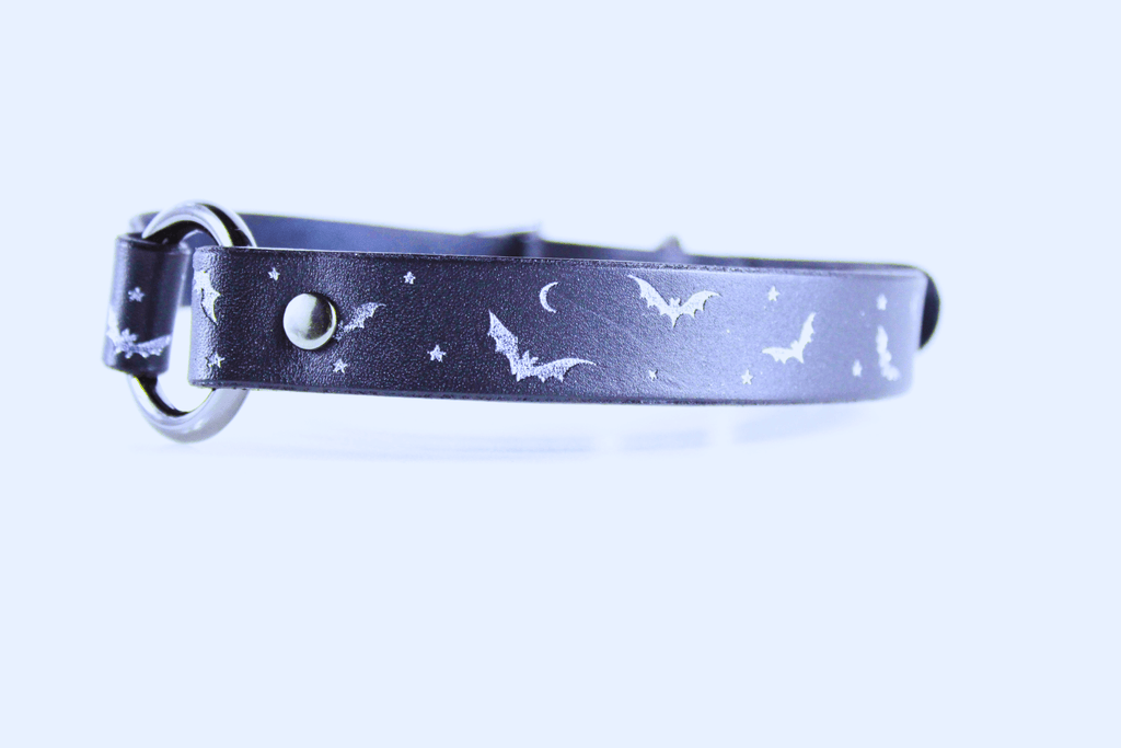 Bat and Moon Leather Choker showcasing bats, crescent moons, and stars on sleek black leather.