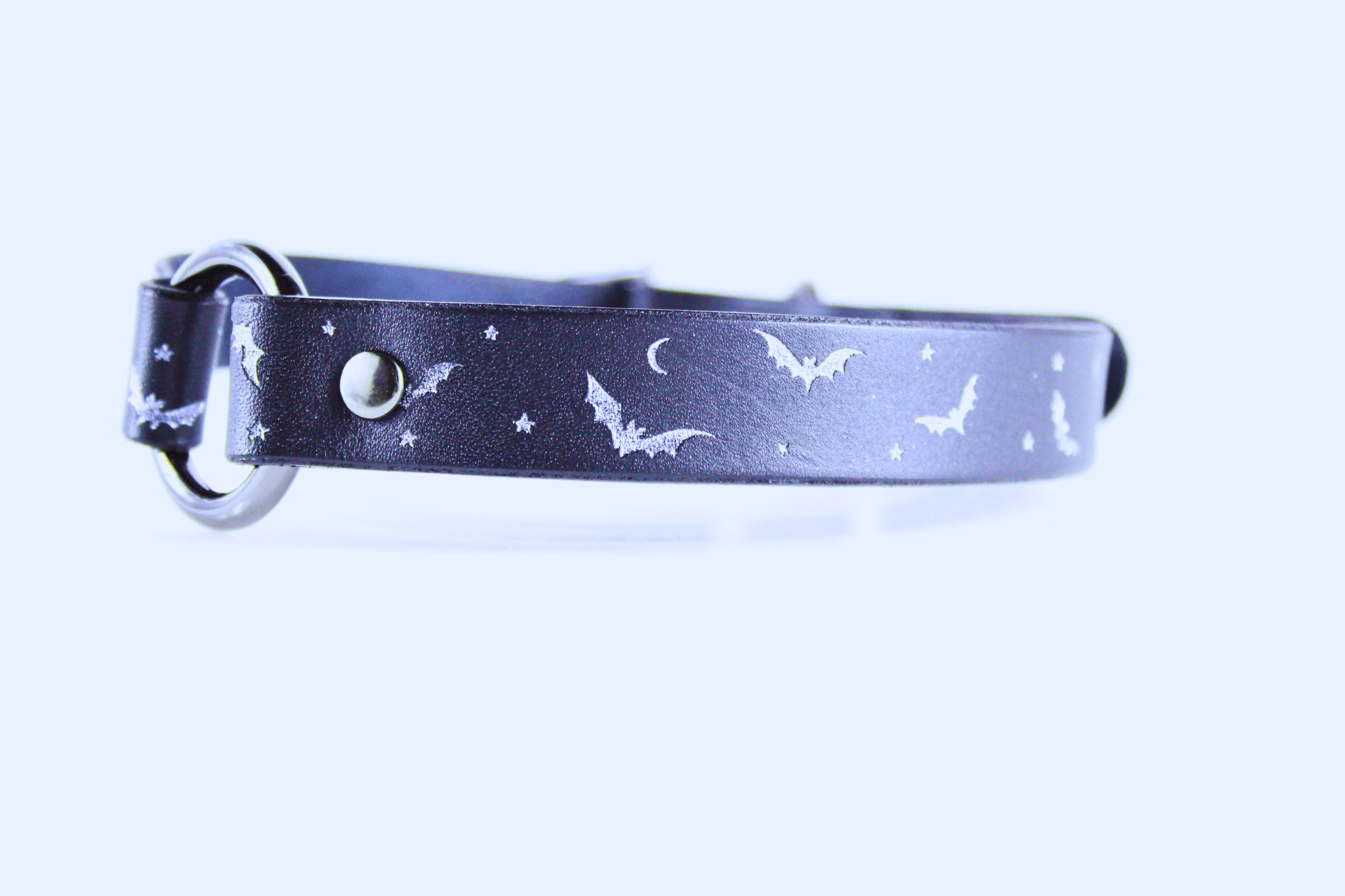 Bat and Moon Leather Choker showcasing bats, crescent moons, and stars on sleek black leather.