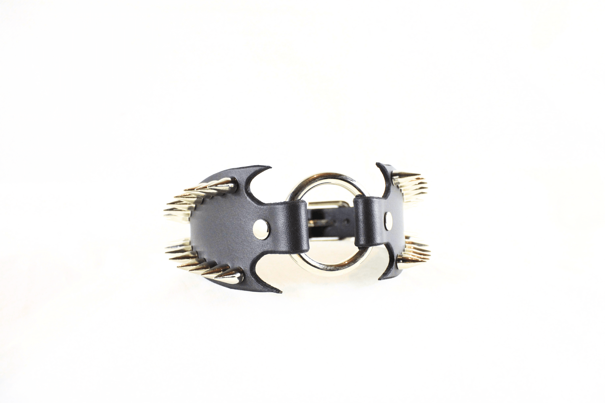 Leather Submissive Collar with spiked edges and metal ring centerpiece, embodying gothic style and BDSM aesthetics.