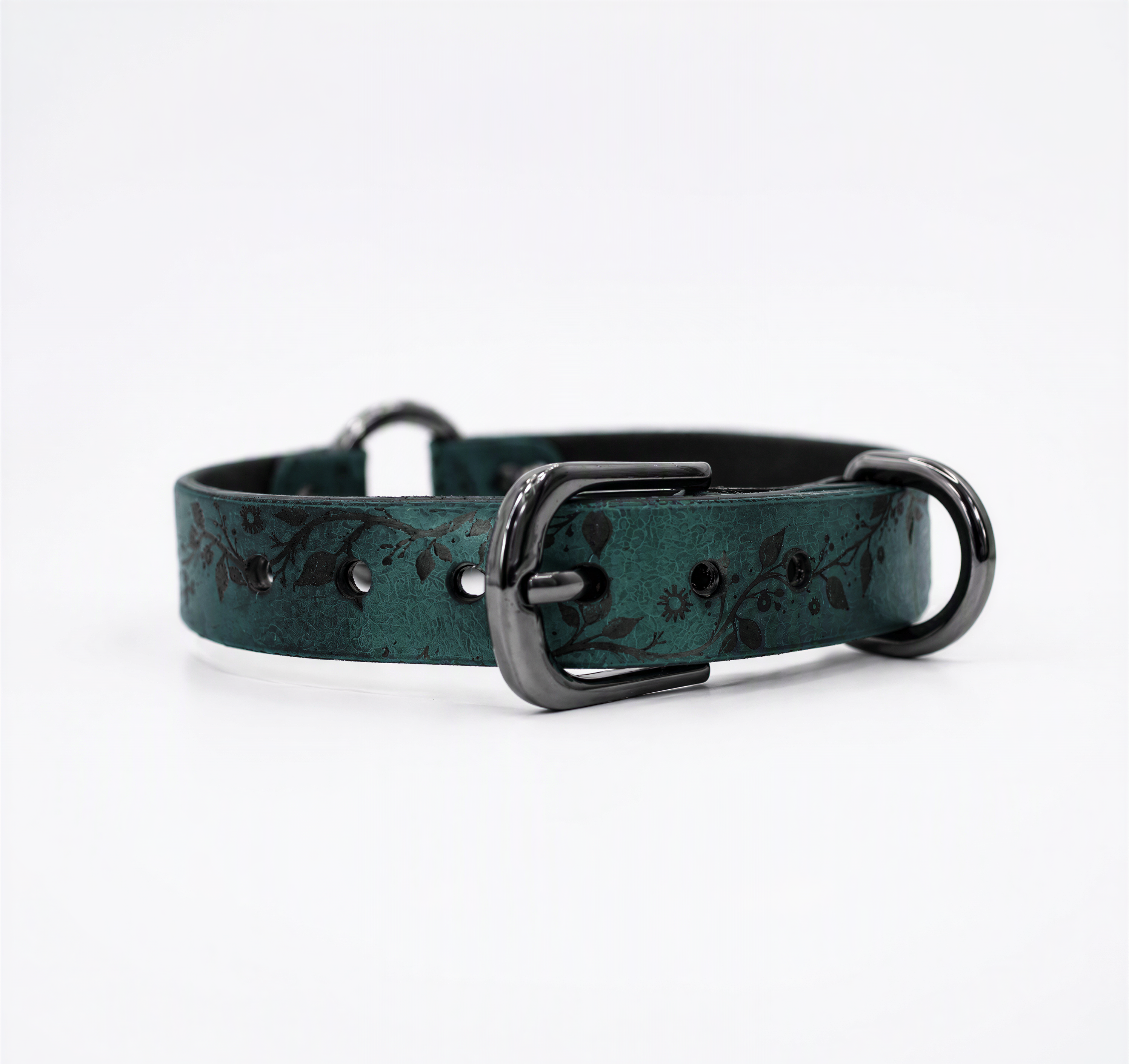 A dark green leather dog collar with a black metal buckle and two metal loops.