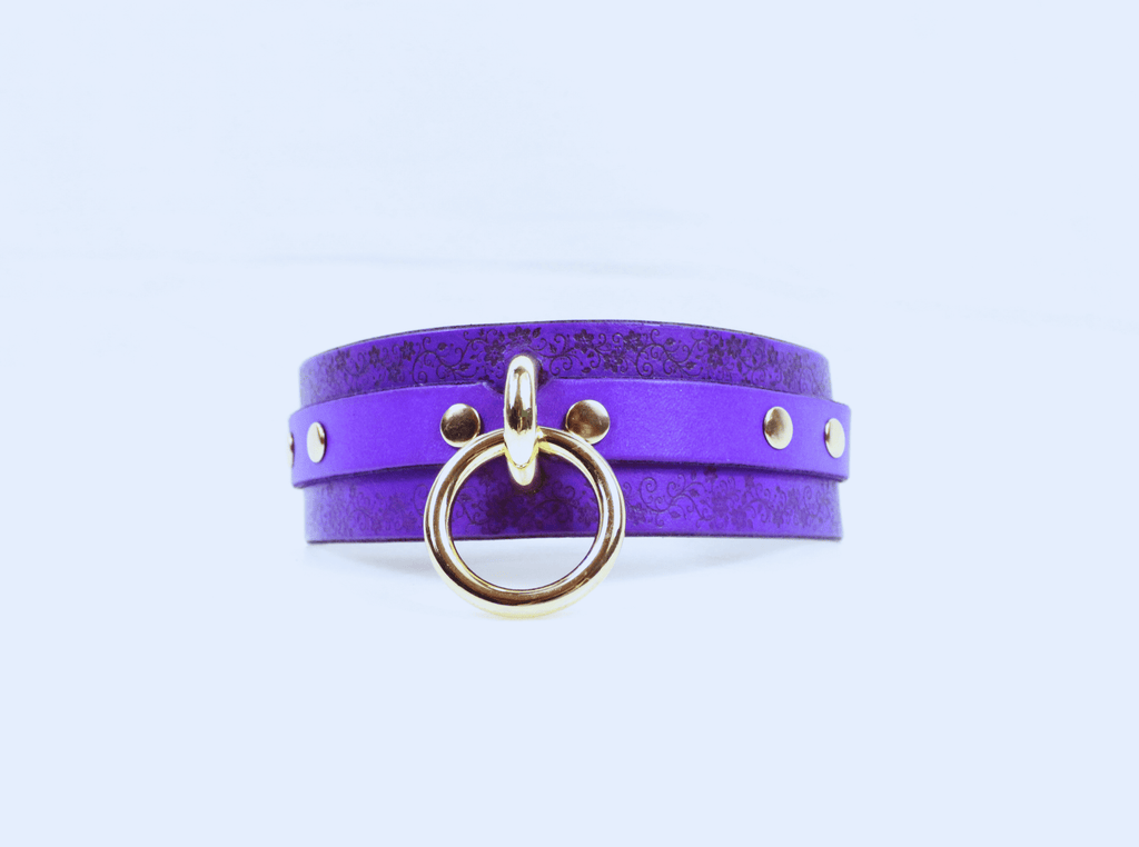 Floral Pattern Submissive Collar in purple leather with gold ring and studs, perfect for discreet day wear.