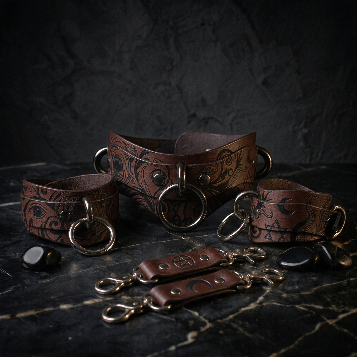 a collection of leather straps and accessories, including choker necklaces and bracelets, arranged on a dark surface.