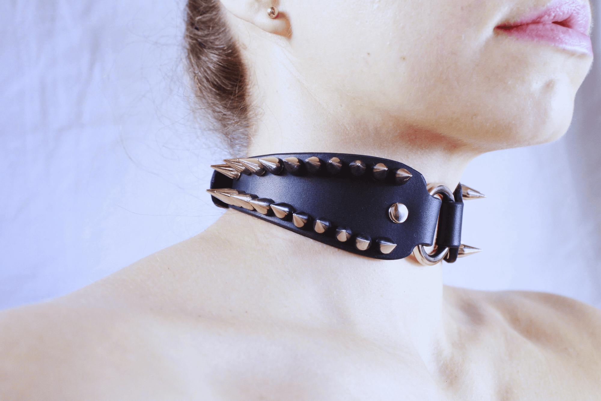 Spiked Submissive Collar worn by a model showcasing its sharp metal spikes and gothic design.