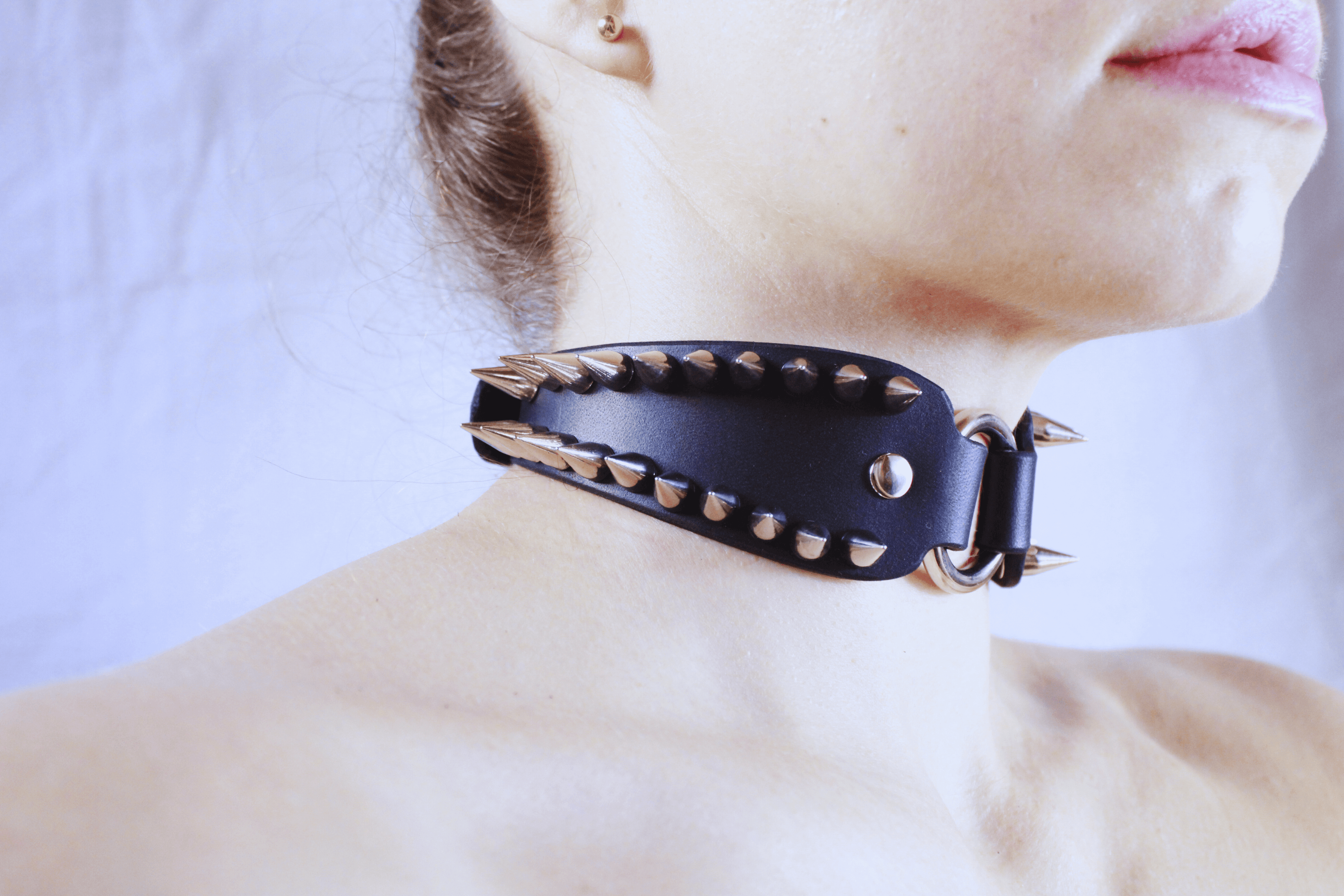 Spiked Submissive Collar worn by a model showcasing its sharp metal spikes and gothic design.