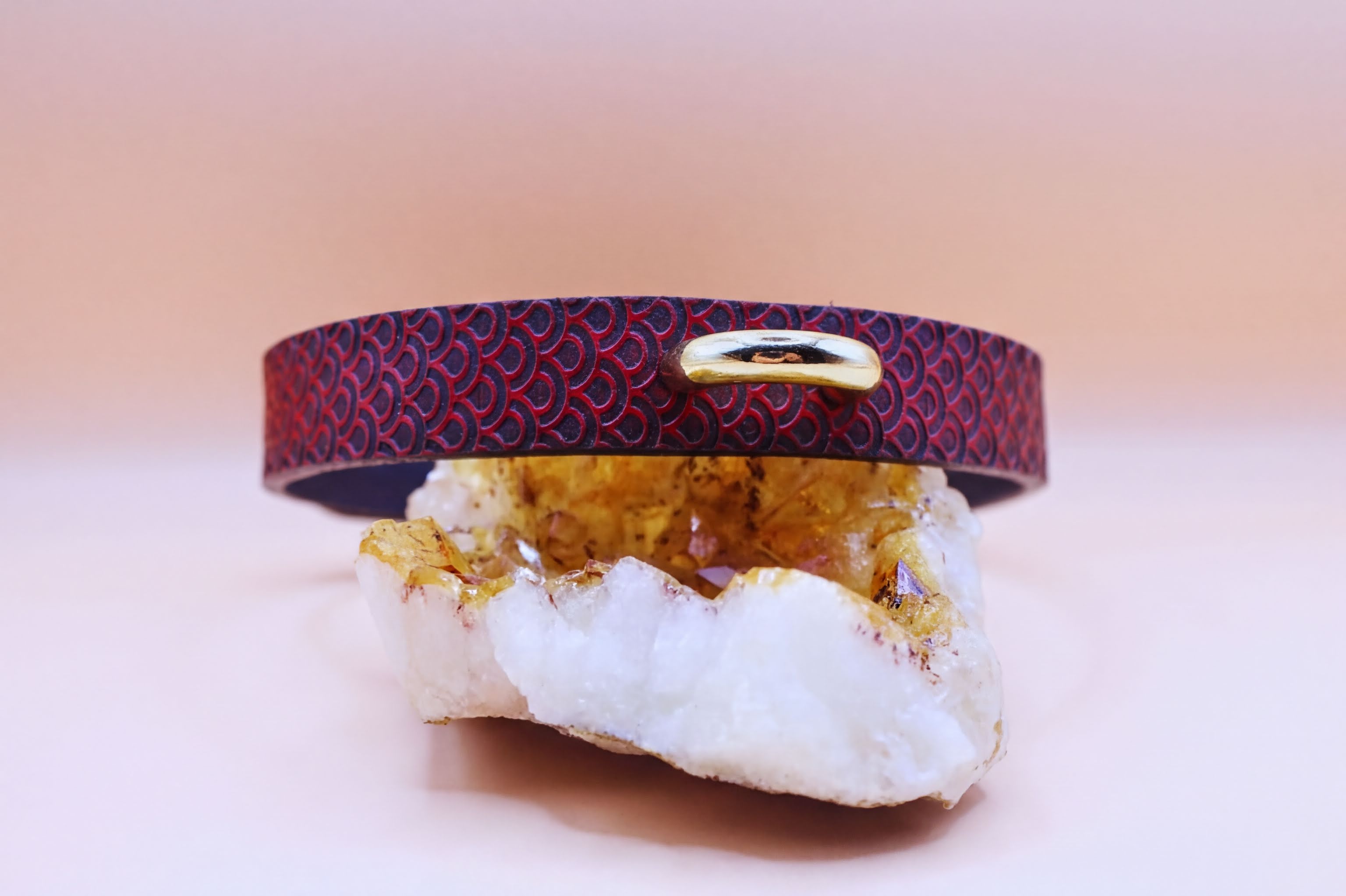 Elegant red leather submissive collar with scale texture, perfect for discreet daily wear and BDSM fashion.