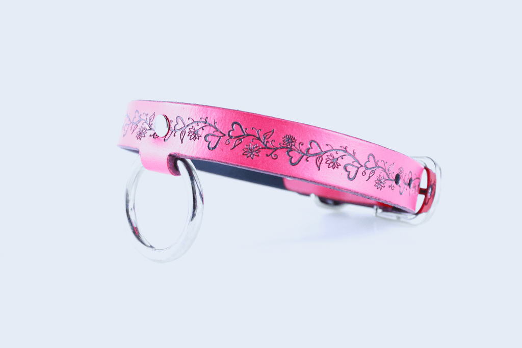 Fetish Collar - pink leather collar with elegant floral design and metal ring for discreet submissive wear.
