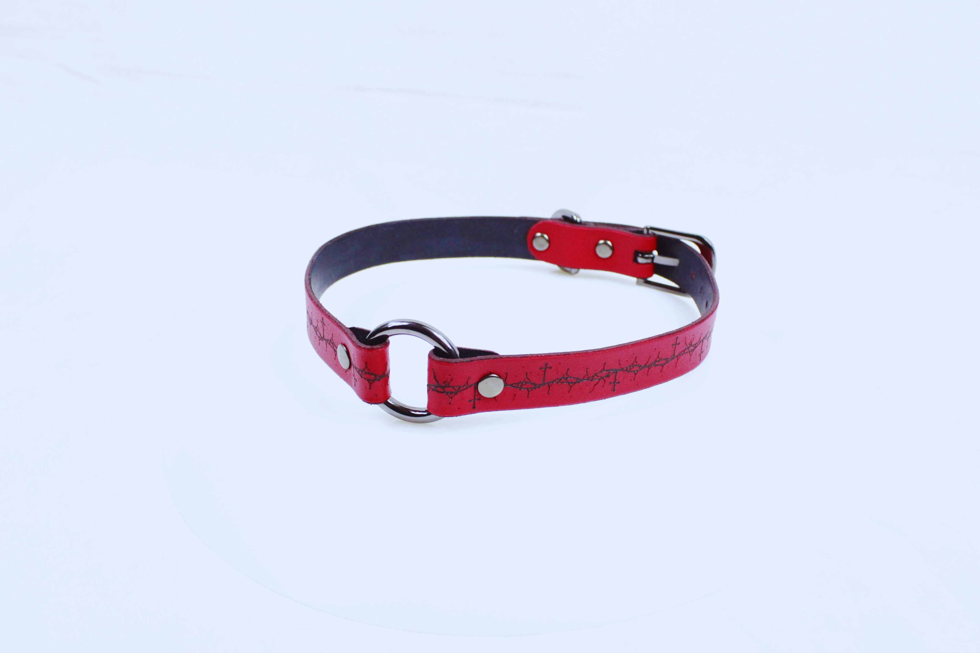 Gothic BDSM Collar with cross and thorn pattern, crafted from premium red leather, showcasing bold design.