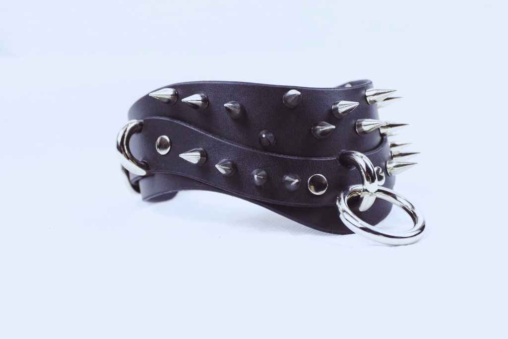 Black Spiked BDSM Collar featuring spikes and a silver D-ring for secure fastening, ideal for gothic and submissive fashion.