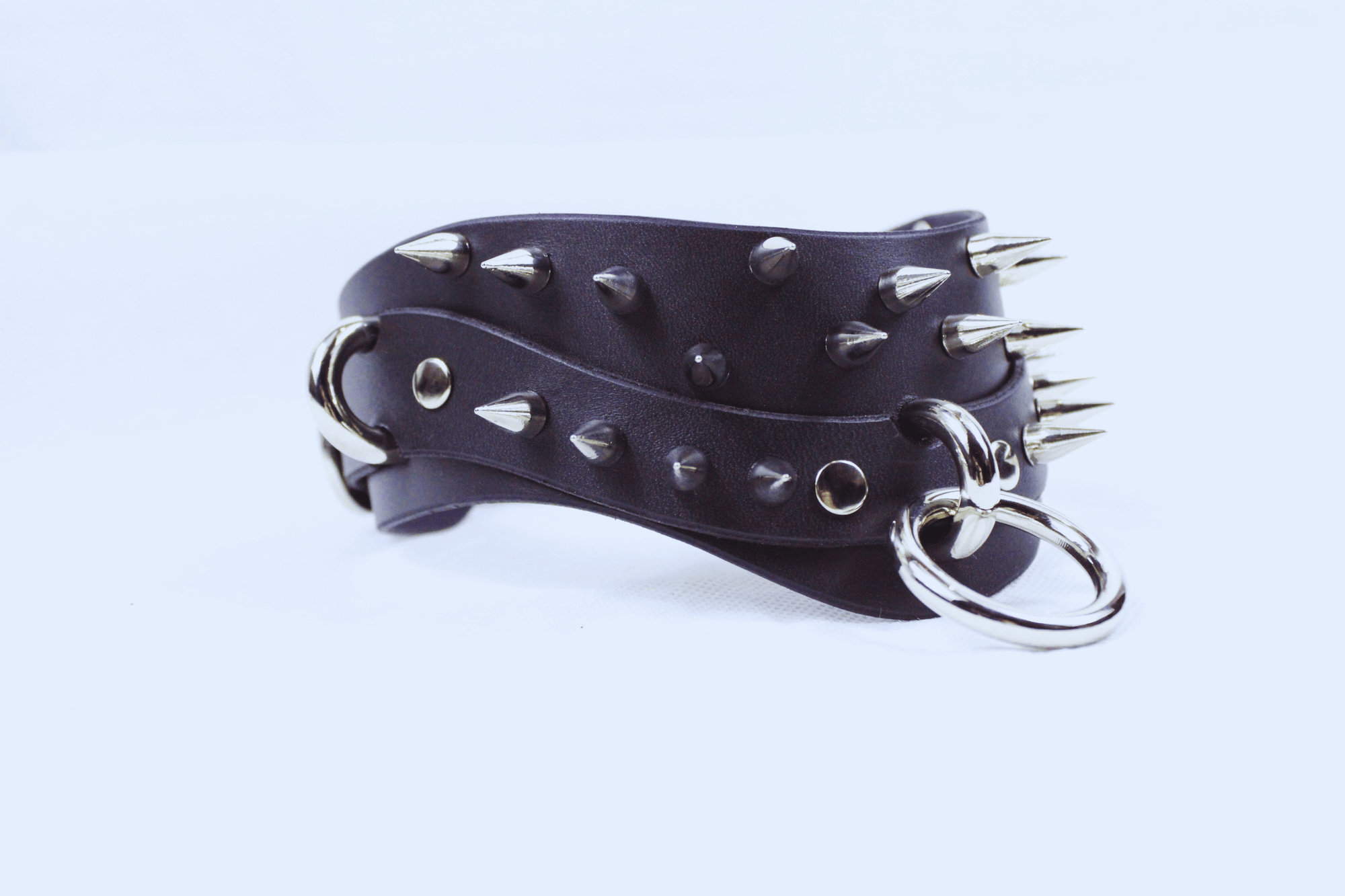 Black Spiked BDSM Collar featuring spikes and a silver D-ring for secure fastening, ideal for gothic and submissive fashion.