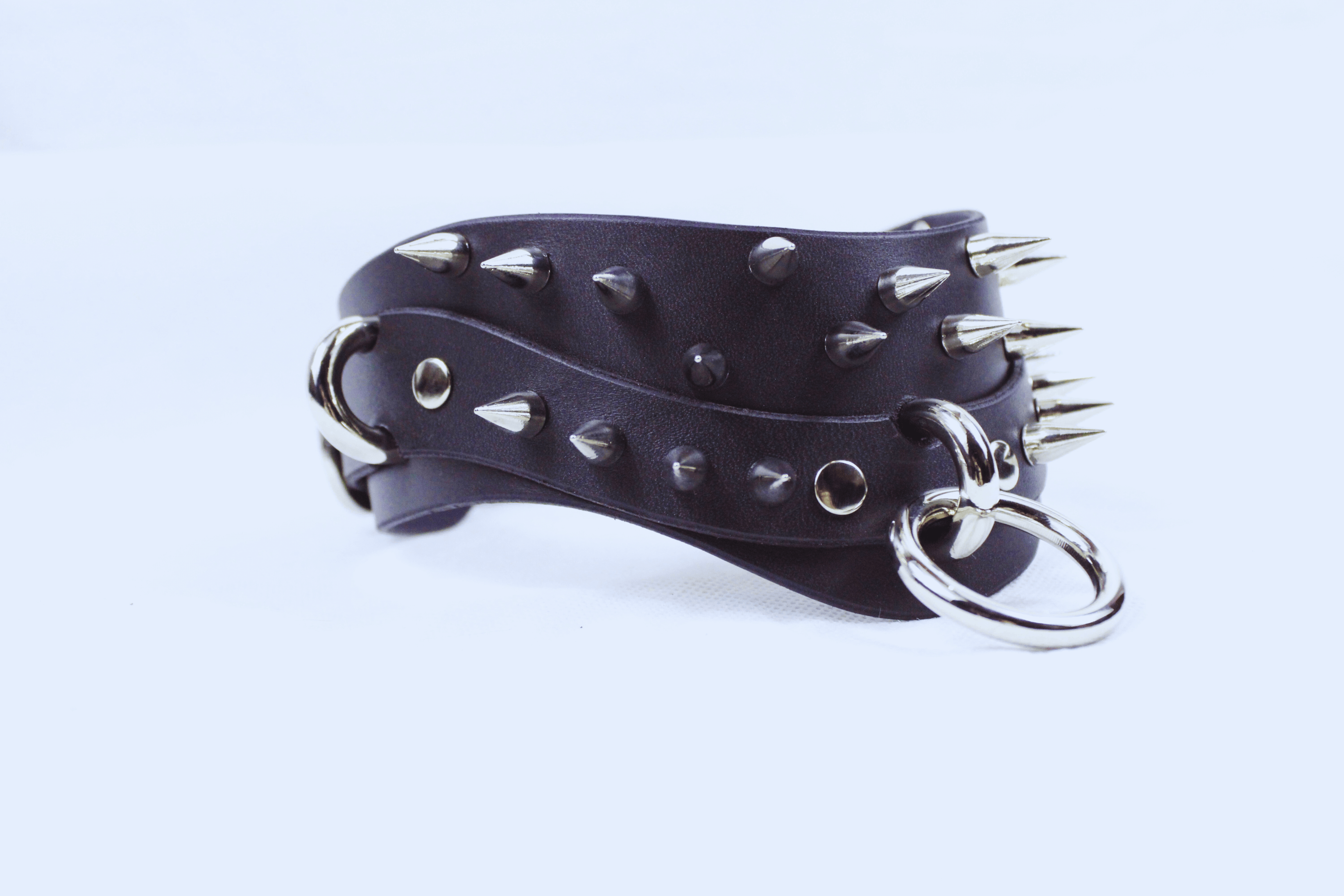 Black Spiked BDSM Collar featuring spikes and a silver D-ring for secure fastening, ideal for gothic and submissive fashion.