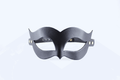 A black mask with a unique, cat-like design is shown against a white background.