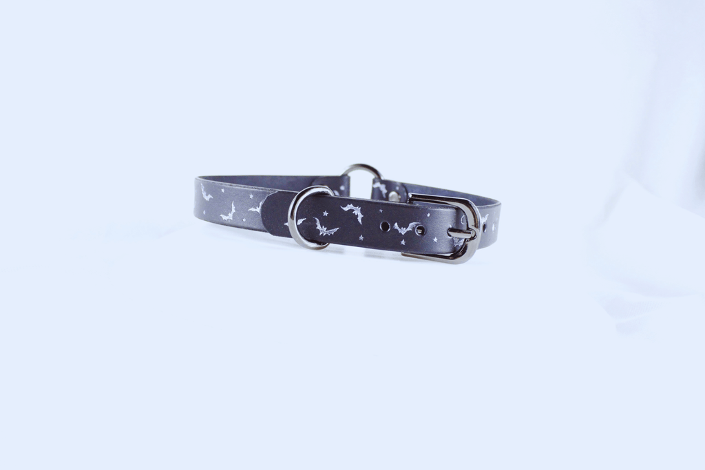 Bat and Moon Leather Choker displaying bats, moons, and stars on a sleek black design.