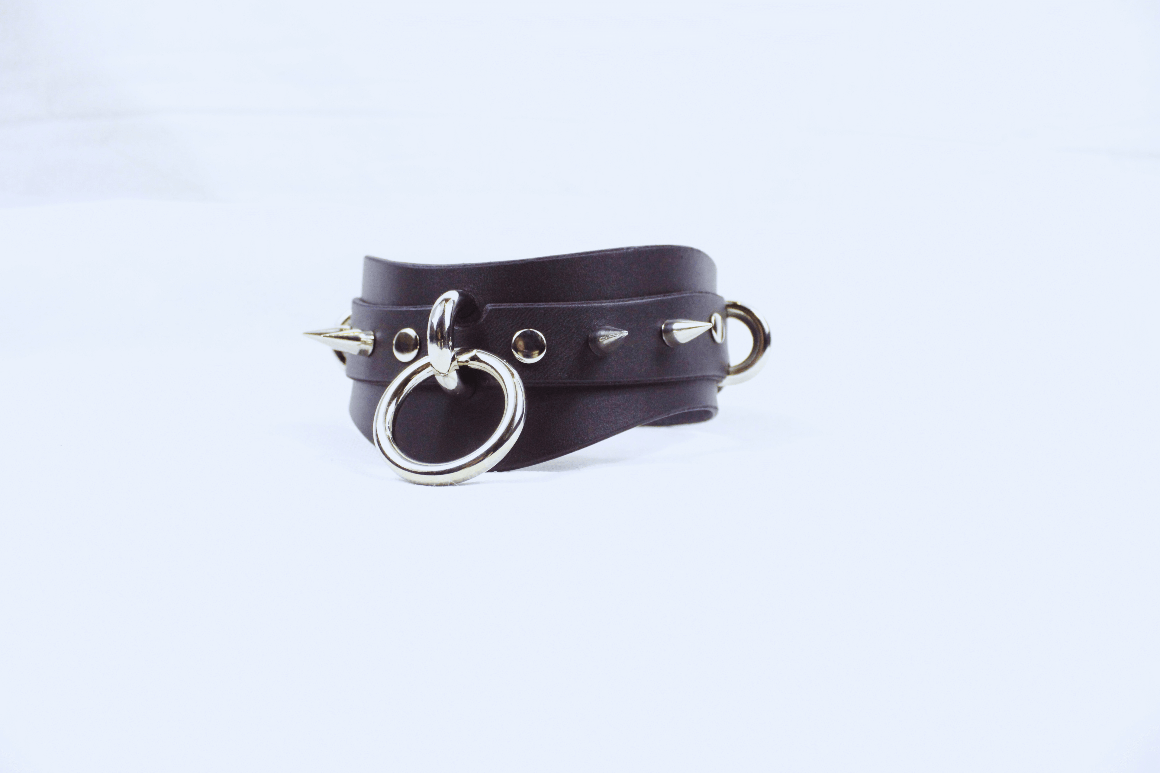 Spiked BDSM Collar – Wide Leather Posture Choker for Submissive Play with spikes and metal rings.