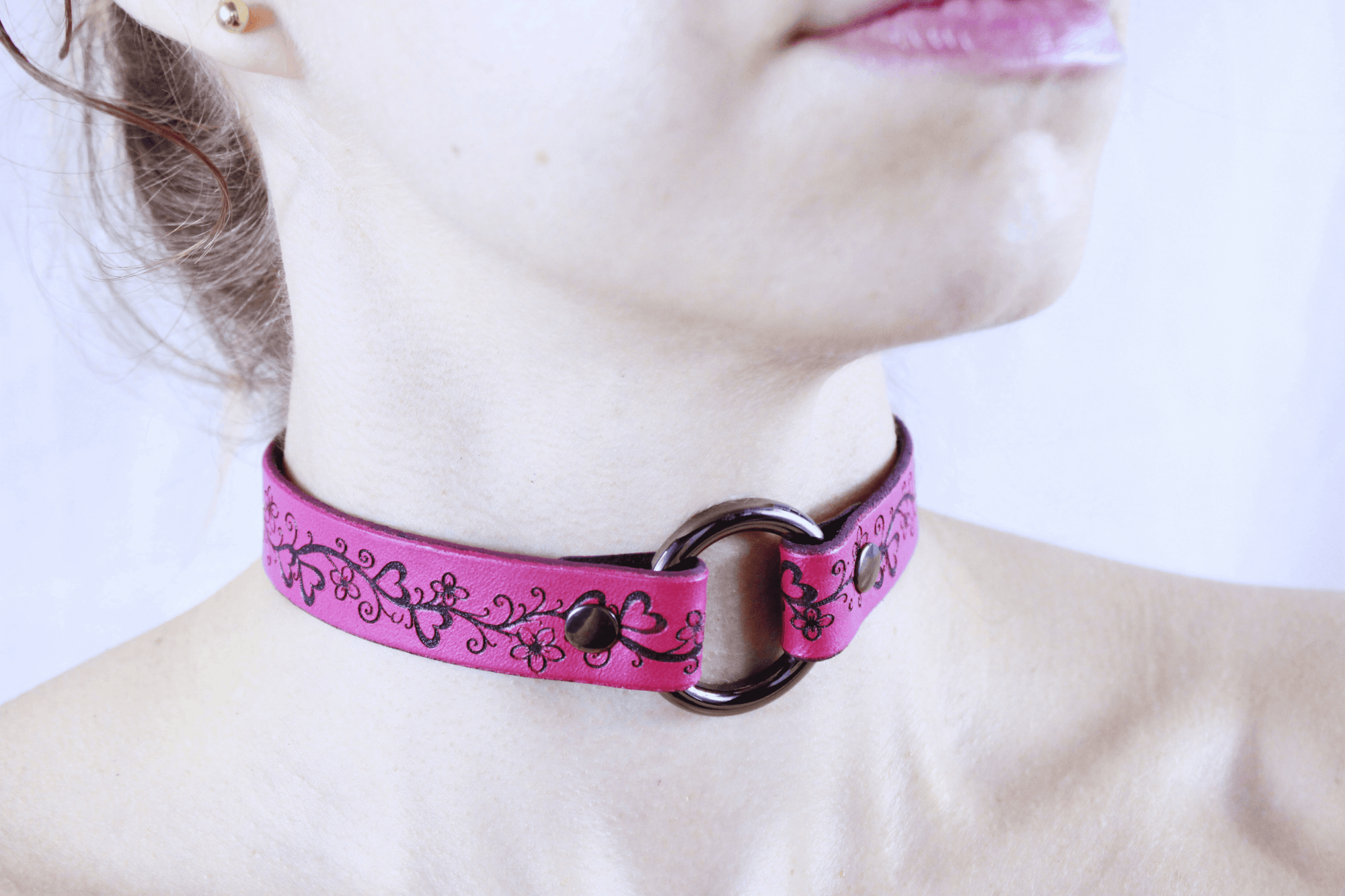 Heart Collar BDSM Pink Floral Vine Leather Choker showcased on a model, highlighting elegant flower and heart patterns.