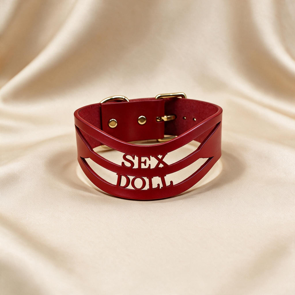 A red leather choker necklace with the word "SEX" printed on it.