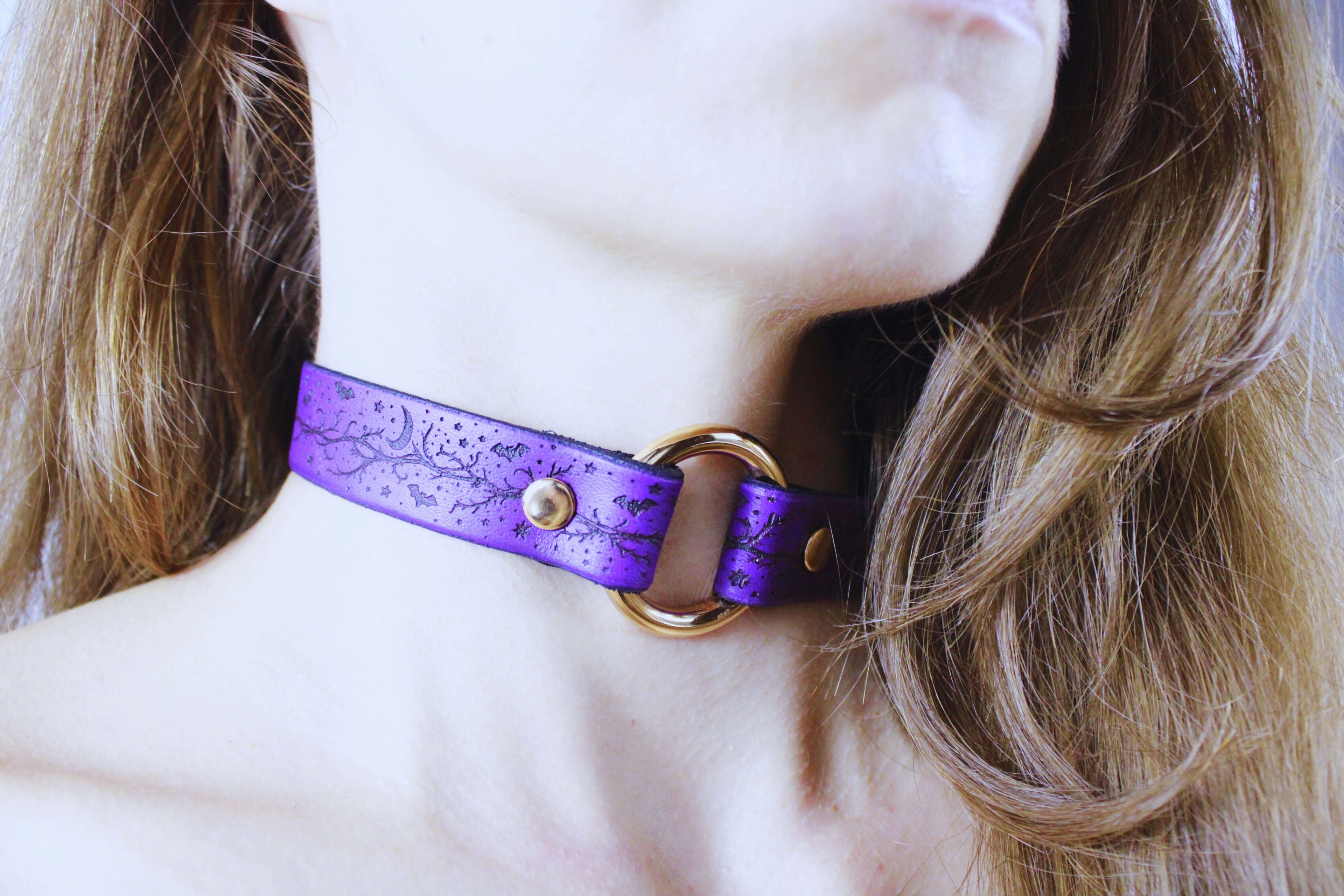Bats Leather Choker worn as a gothic discreet day collar, featuring purple leather and gold hardware, ideal for dark aesthetics.