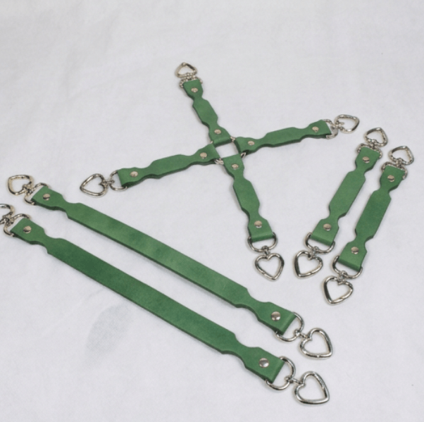 A group of green leather straps with metal heart-shaped buckles, arranged in a cross-like pattern on a white background.
