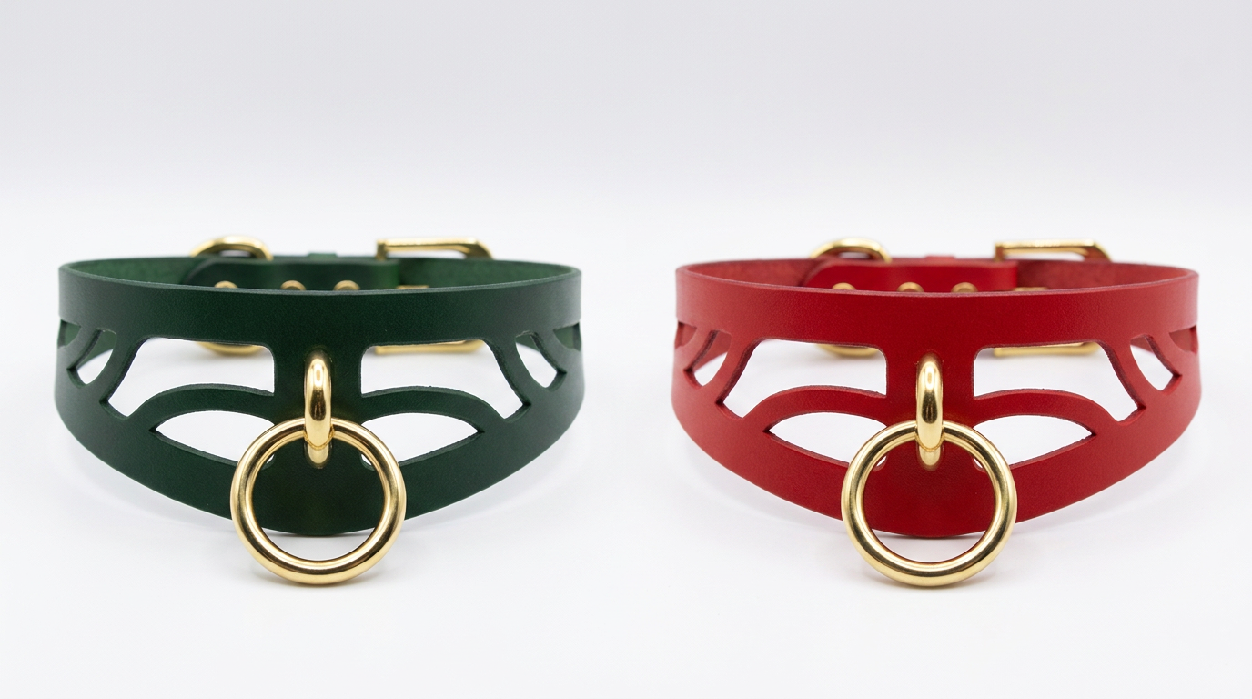 two leather choker necklaces with gold-colored metal rings, one in green and the other in red.