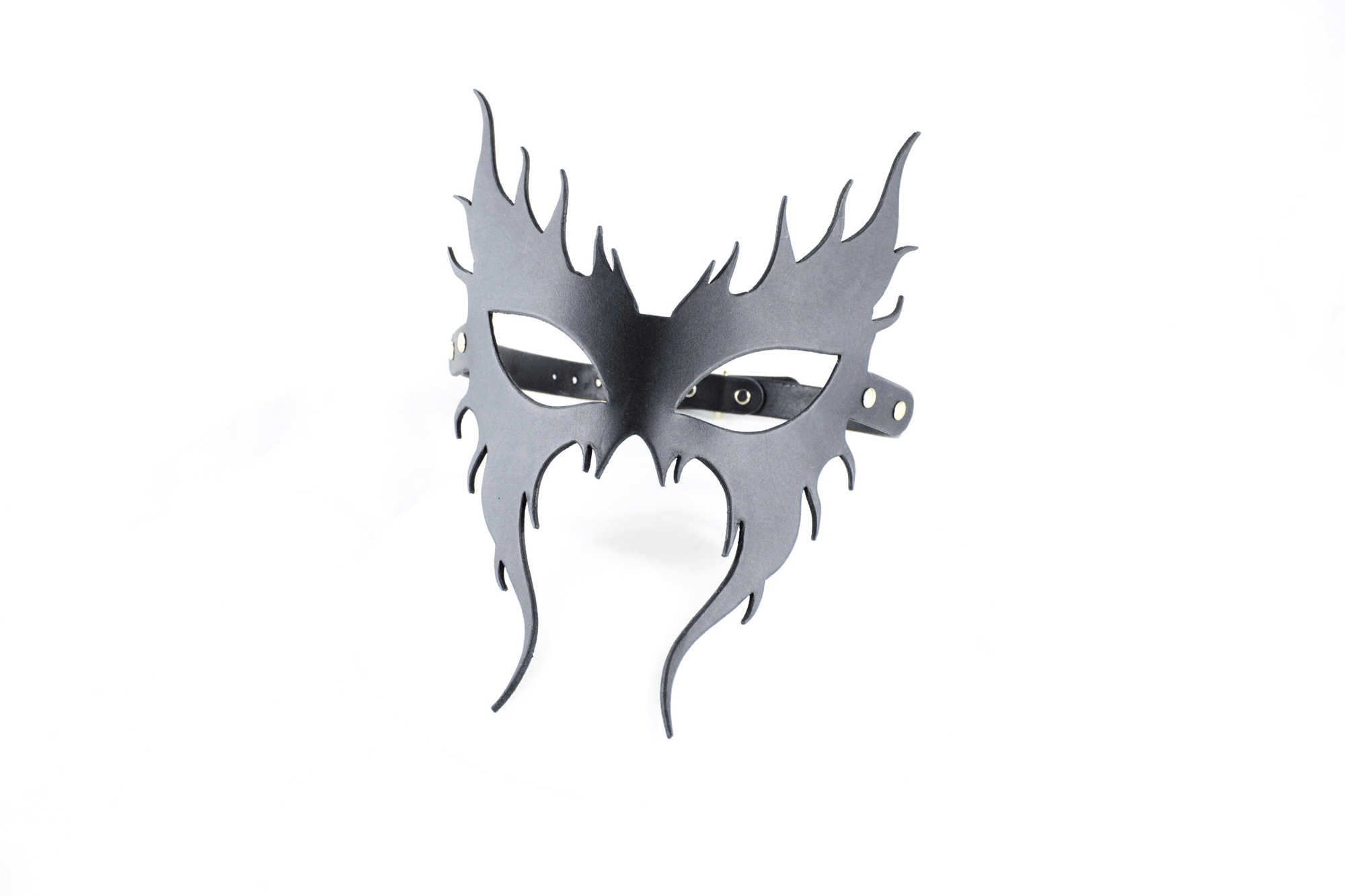 A black mask with a stylized design, resembling a mask or mask-like object.