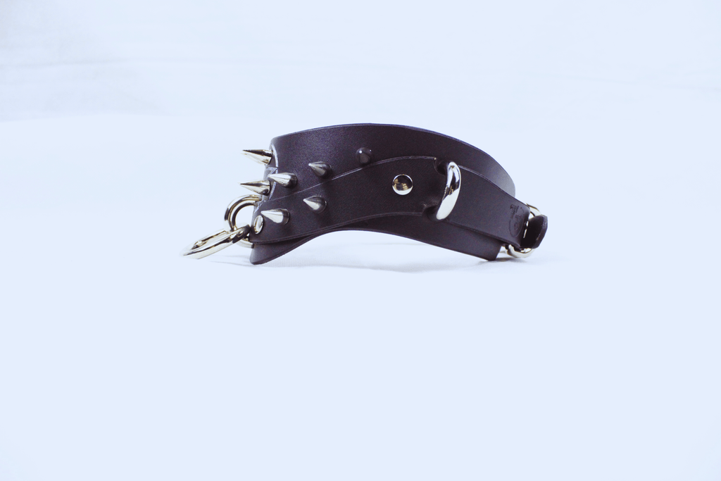 Pentagram BDSM Collar – Spiked Posture Submissive Choker with O-Rings shown at an angle.