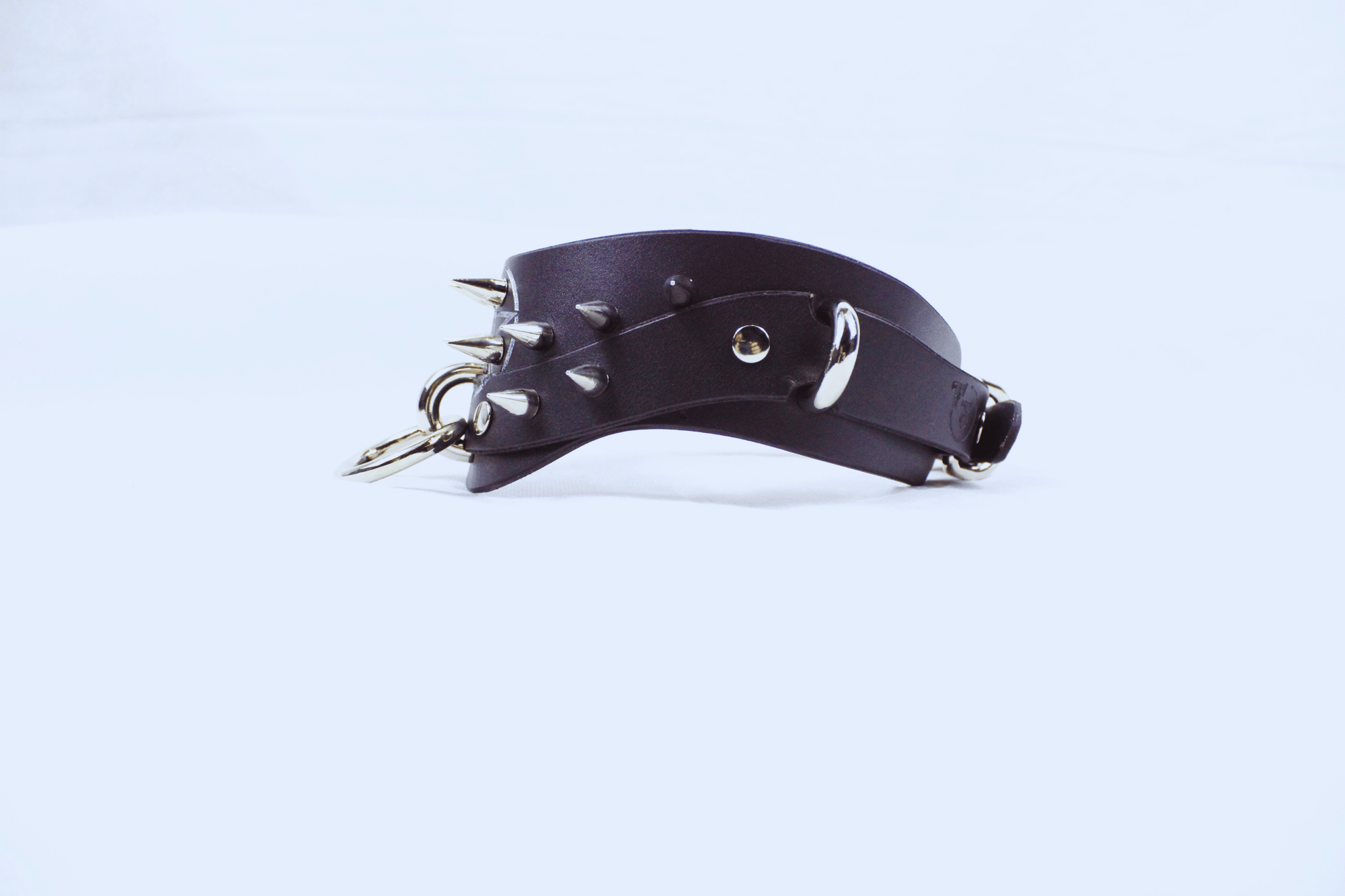 Pentagram BDSM Collar – Spiked Posture Submissive Choker with O-Rings shown at an angle.