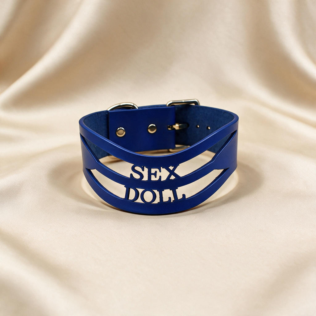 A blue leather choker necklace with the text "SEX DOLL" printed on it.