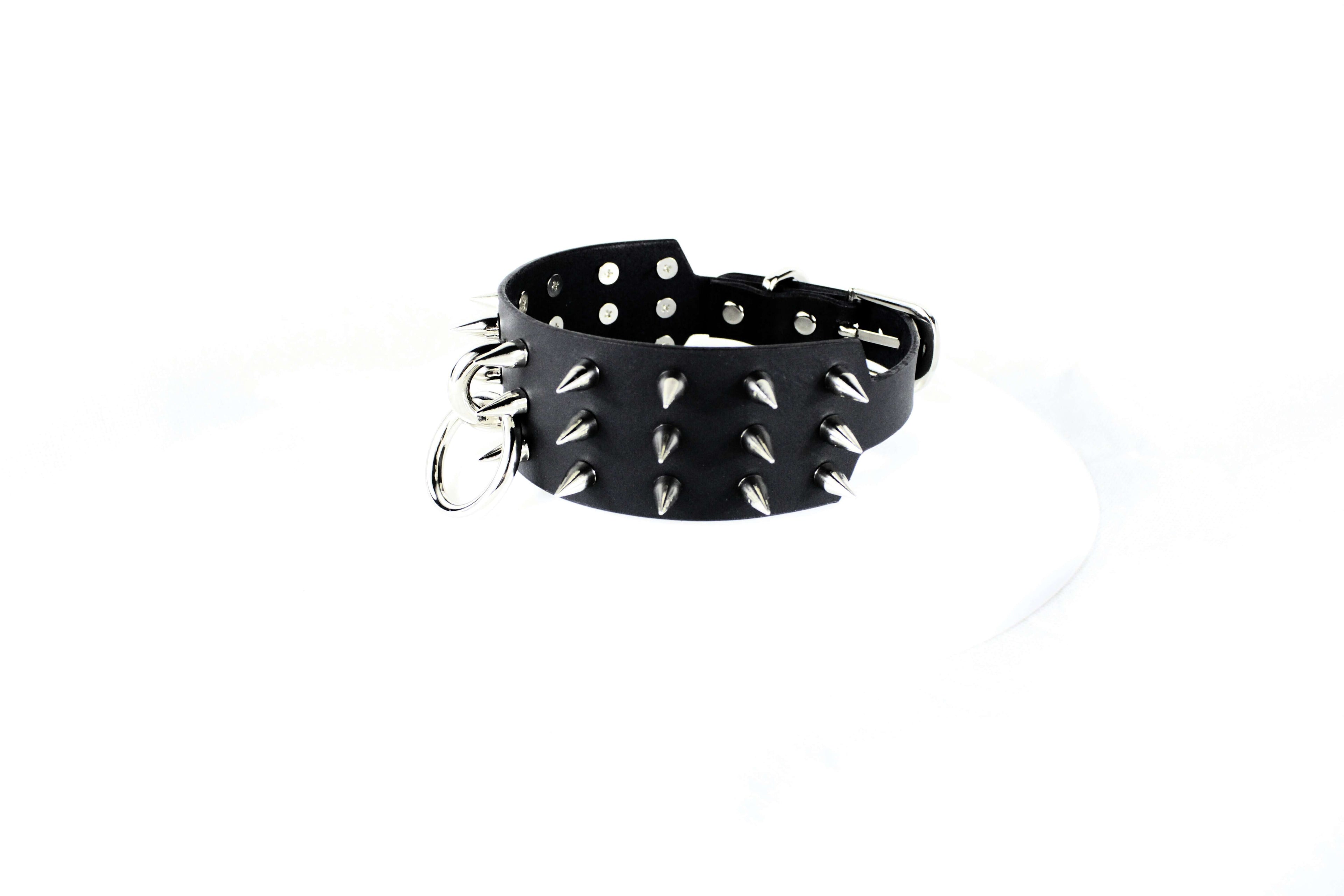 Black Spiked BDSM Collar – Leather Submissive Collar with O-Ring featuring polished metal spikes.