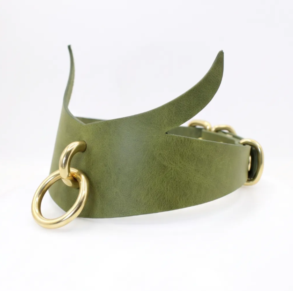 four leather choker necklaces with different colors and designs, including purple, green, black, and silver rings.