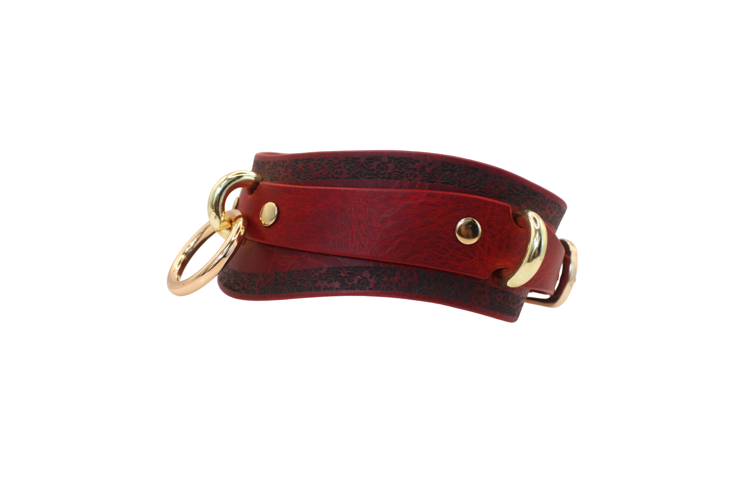 A red leather collar with gold hardware, including two rings and a buckle, is shown against a white background.