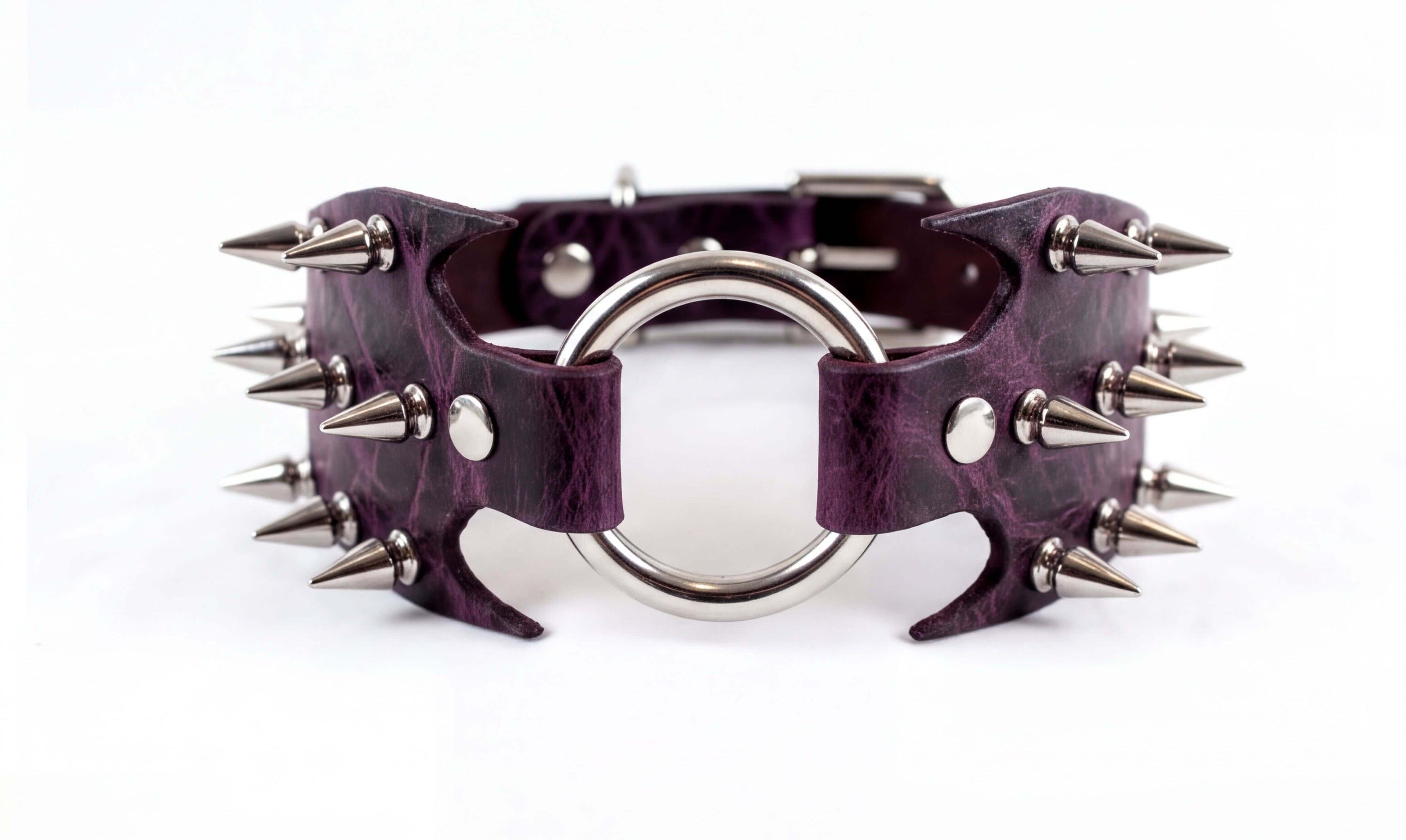 A purple leather choker necklace with a metal ring and spikes protruding from it.