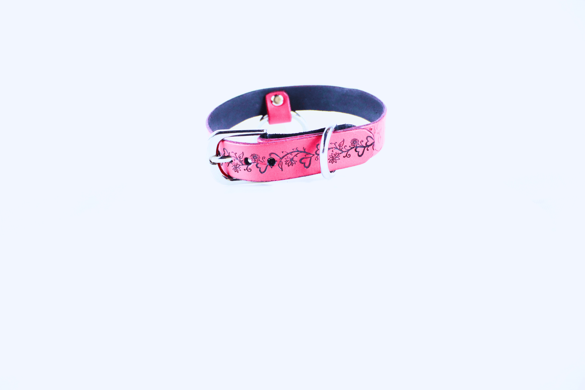 Fetish Collar made of pink leather with delicate floral designs, symbolizing subtle submission and elegance.