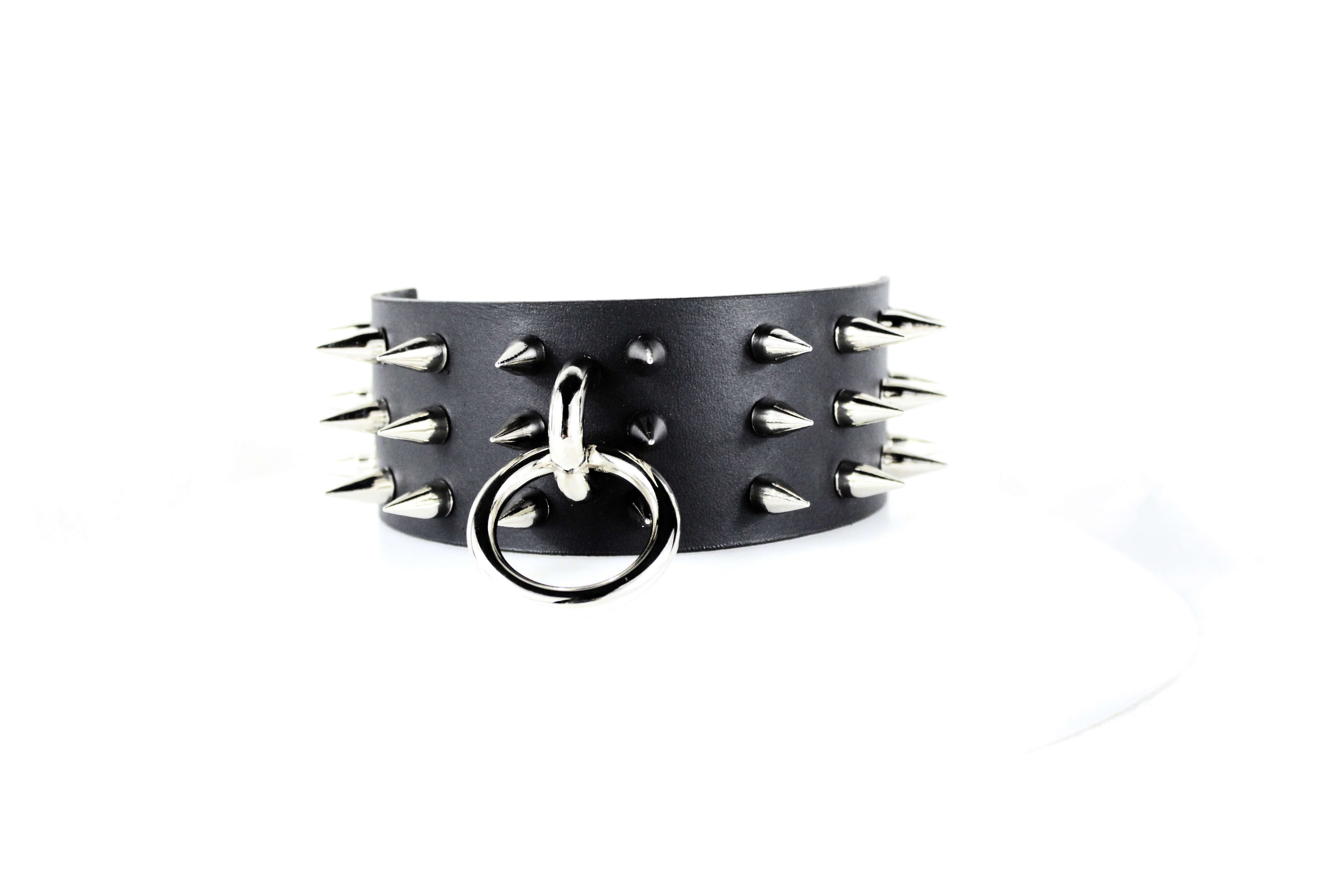 Black Spiked BDSM Collar – Leather Submissive Collar with O-Ring, featuring polished spikes and a metal O-ring.