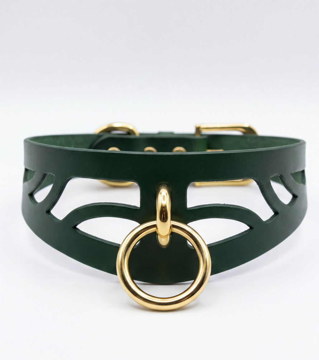 A dark green leather choker necklace with a gold-colored metal ring and a gold-colored metal buckle.