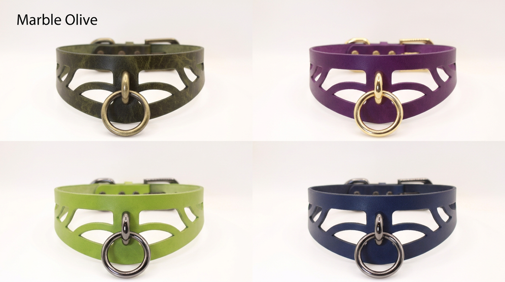 four different choker necklaces, each with a unique color and design. The necklaces are arranged in a grid format, with two necklaces in each row and two necklaces in each column. The necklaces have a distinctive circular design with metal rings, and they come in various colors, including green, purple, and blue.