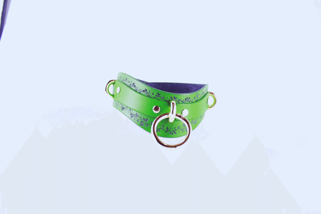 Green Vine Leather Submissive Collar with a black vine pattern and polished rings for a stylish look.